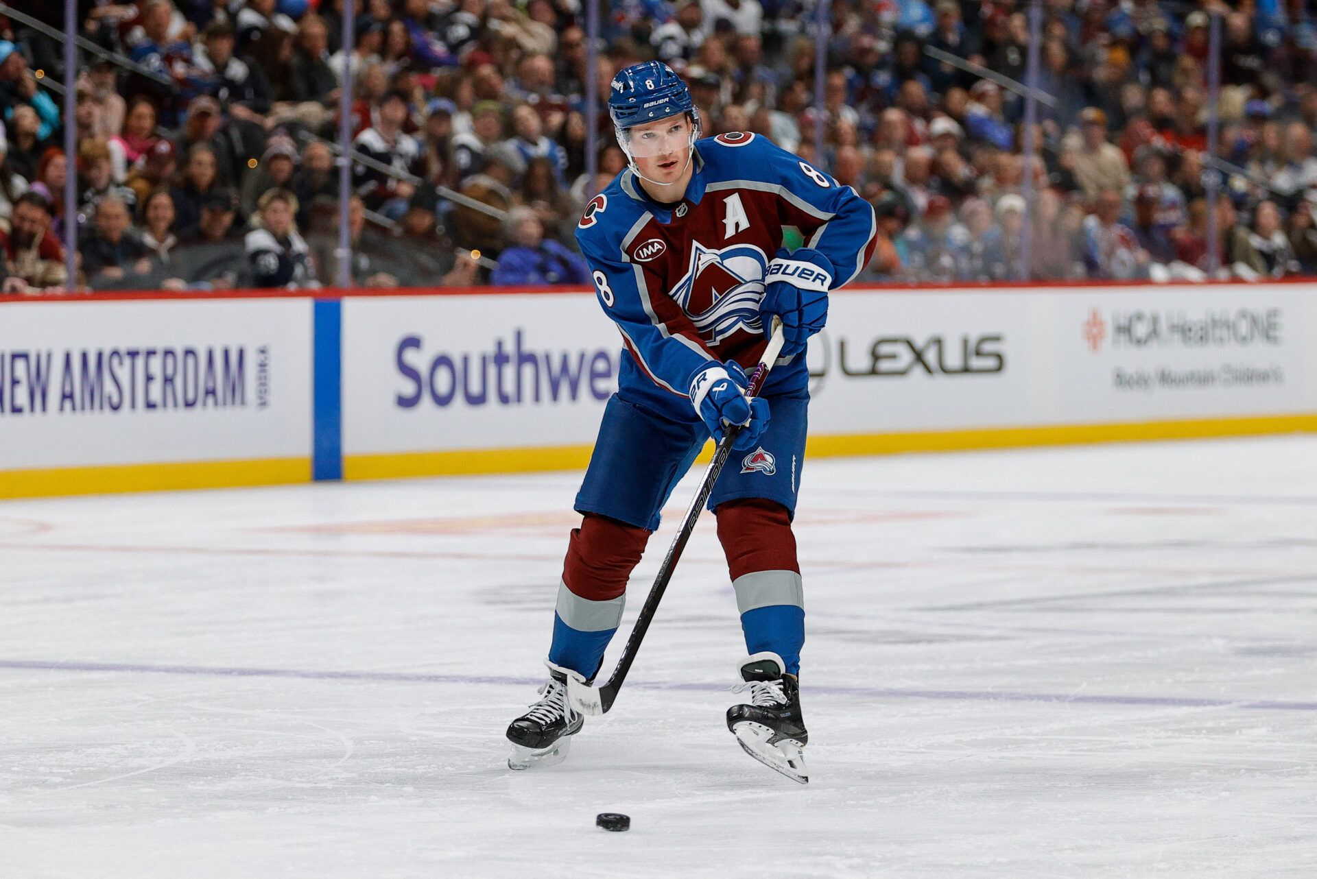 Colorado Avalanche defenseman Cale Makar (8) passes the puck in the second period against the New Jersey Devils at Ball Arena.