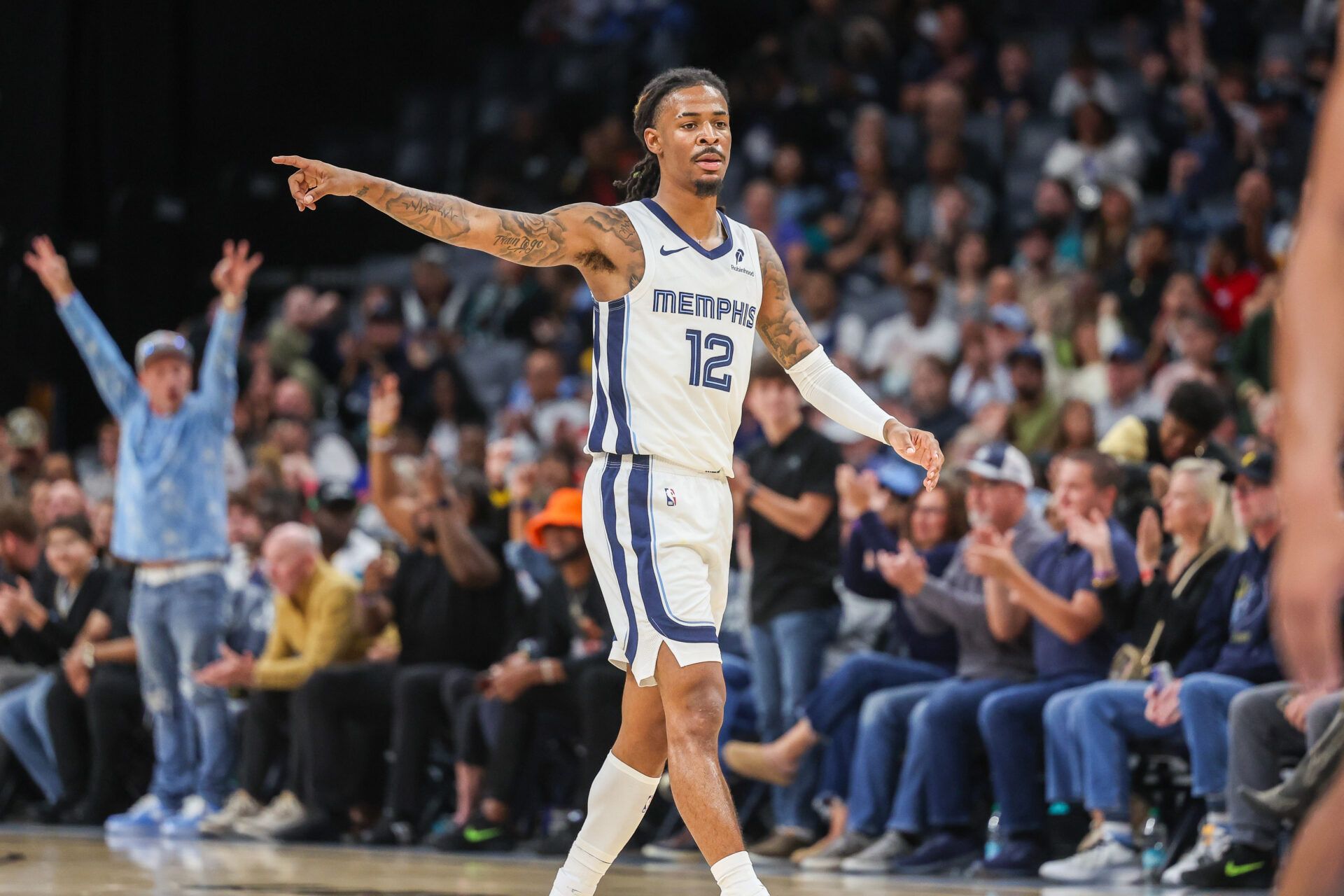 Memphis Grizzlies guard Ja Morant (12) reacts after a made basket against the Indiana Pacers during the first half at FedExForum.