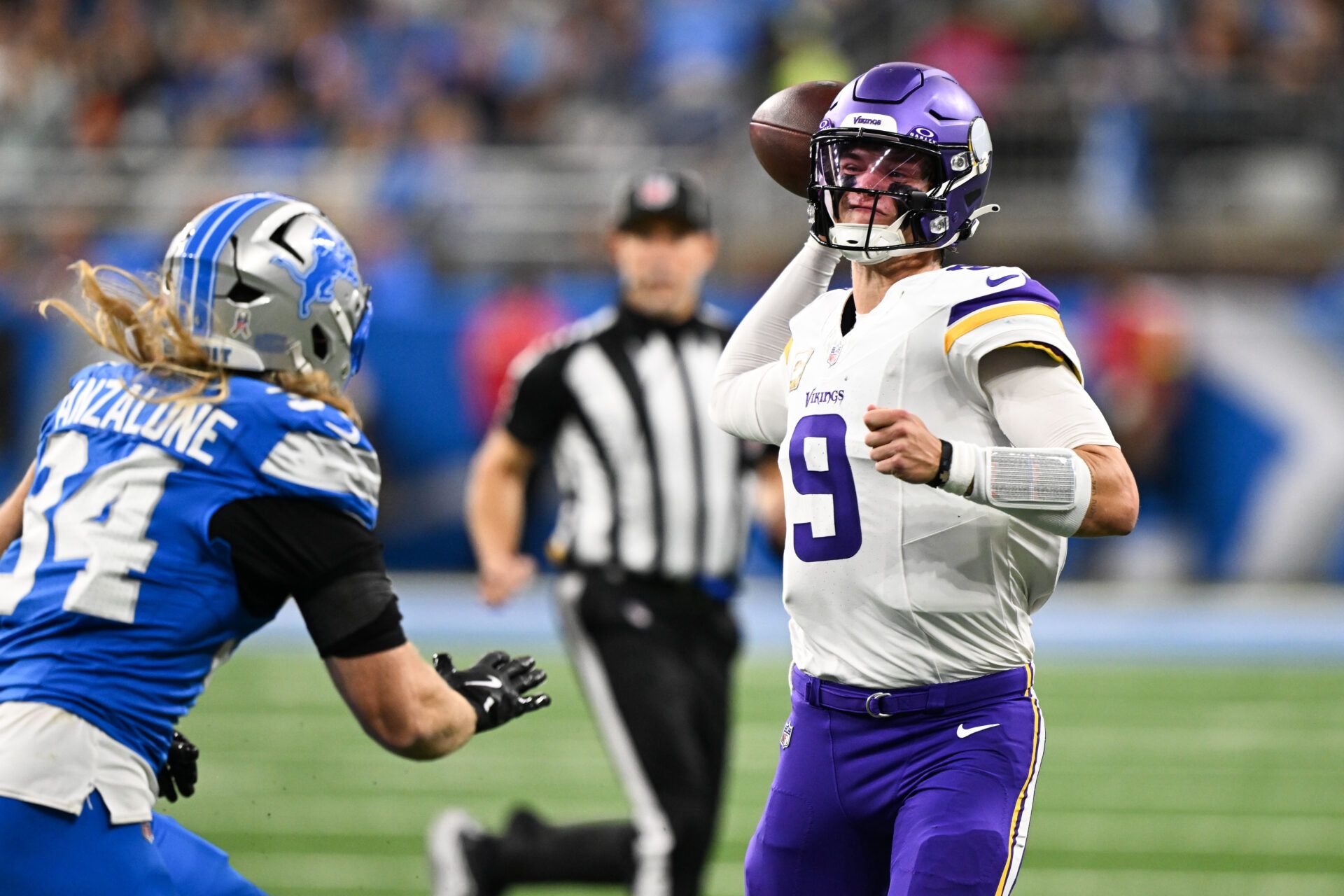 Minnesota Vikings quarterback J.J. McCarthy (9) throws the ball during the first quarter against the Minnesota Vikings at Ford Field.