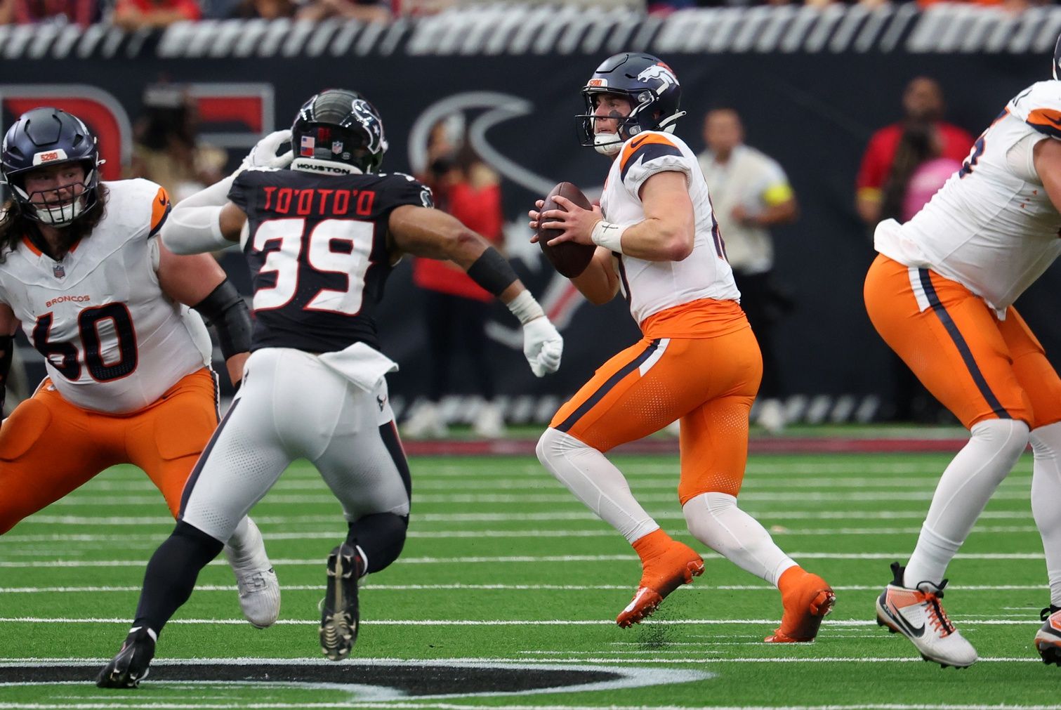 Denver Broncos quarterback Bo Nix (10) drops to throw during the second half against the Houston Texans at NRG Stadium.