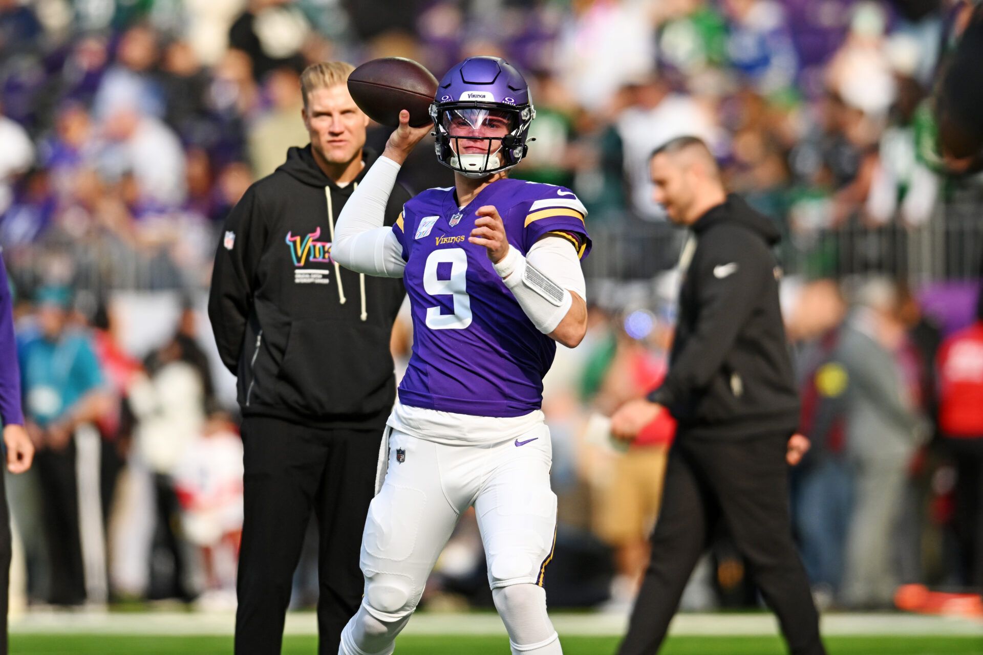Minnesota Vikings quarterback J.J. McCarthy (9) throws a pass during warm ups before the game against the Philadelphia Eagles at U.S. Bank Stadium.