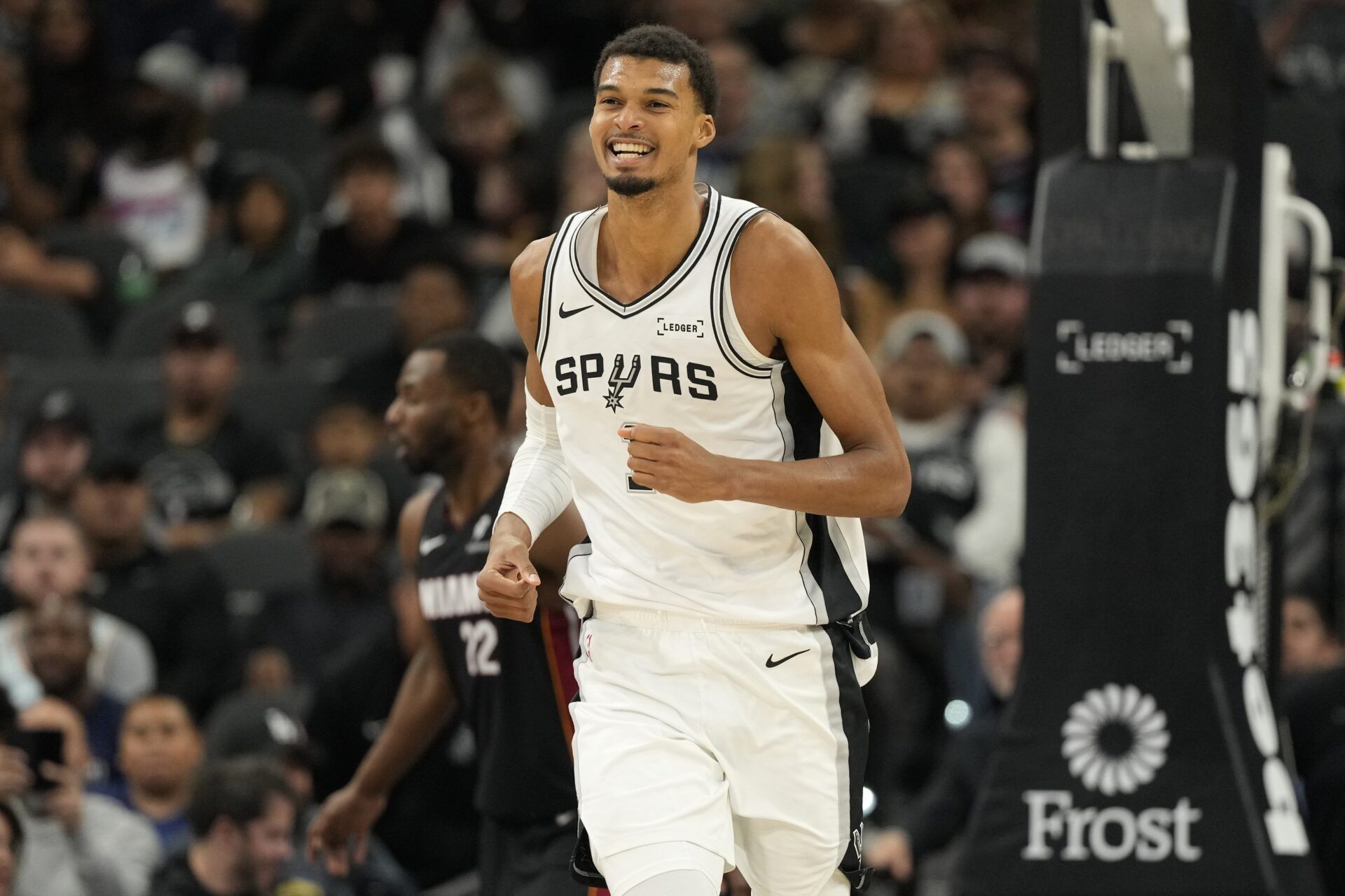 San Antonio Spurs forward Victor Wembanyama (1) reacts after losing the ball out of bounds during the second half against the Miami Heat at Frost Bank Center.