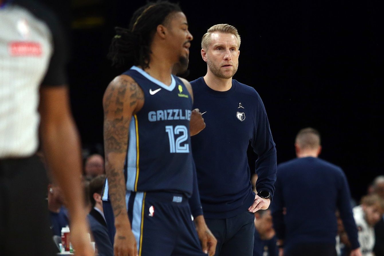 Memphis Grizzlies head coach Tuomas Iisalo looks on as guard Ja Morant (12) checks into the game during the second quarter against the Detroit Pistons at FedExForum.