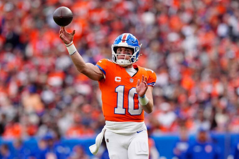 Denver Broncos quarterback Bo Nix (10) throws a pass against the Dallas Cowboys in the fourth quarter at Empower Field at Mile High.