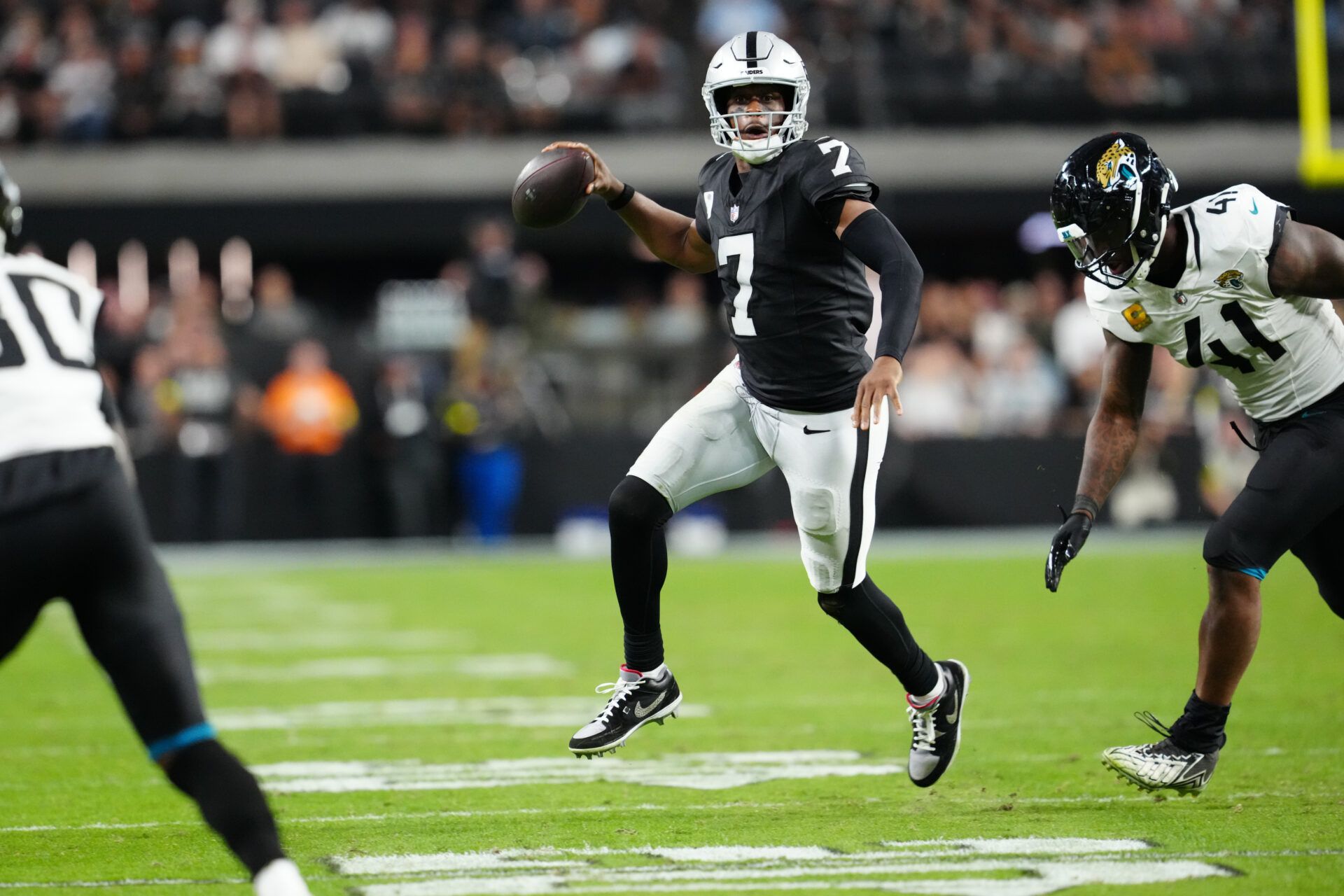 Las Vegas Raiders quarterback Geno Smith (7) makes a pass during the second half against the Jacksonville Jaguars at Allegiant Stadium.