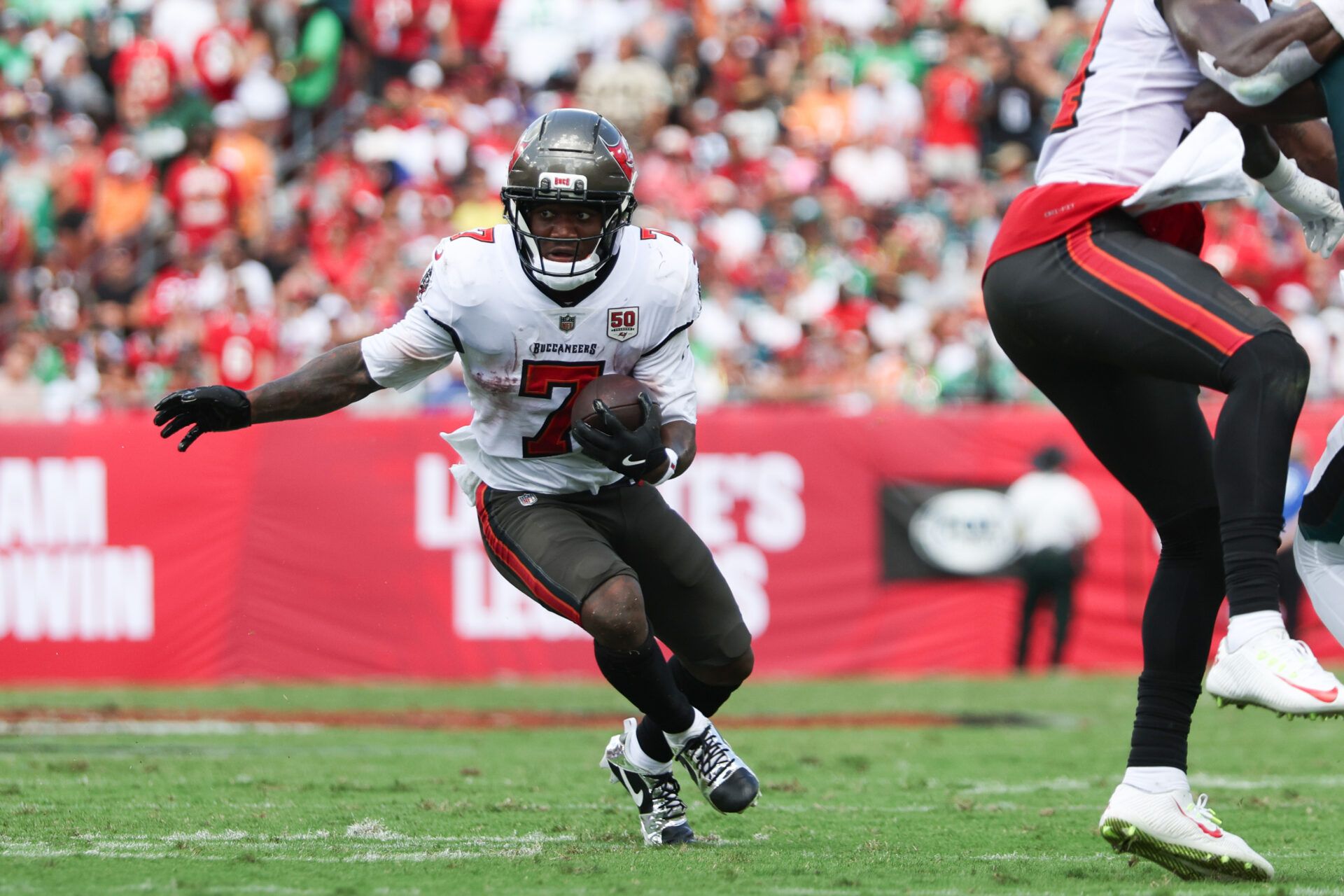 Tampa Bay Buccaneers running back Bucky Irving (7) runs the ball during the first quarter against the Philadelphia Eagles  at Raymond James Stadium.