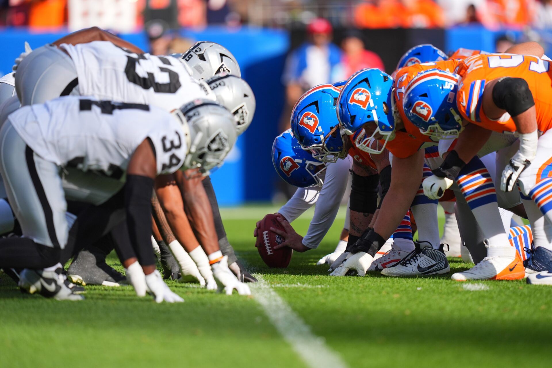 Members of the Las Vegas Raiders line up across from against the Denver Broncos in the second half at Empower Field at Mile High.