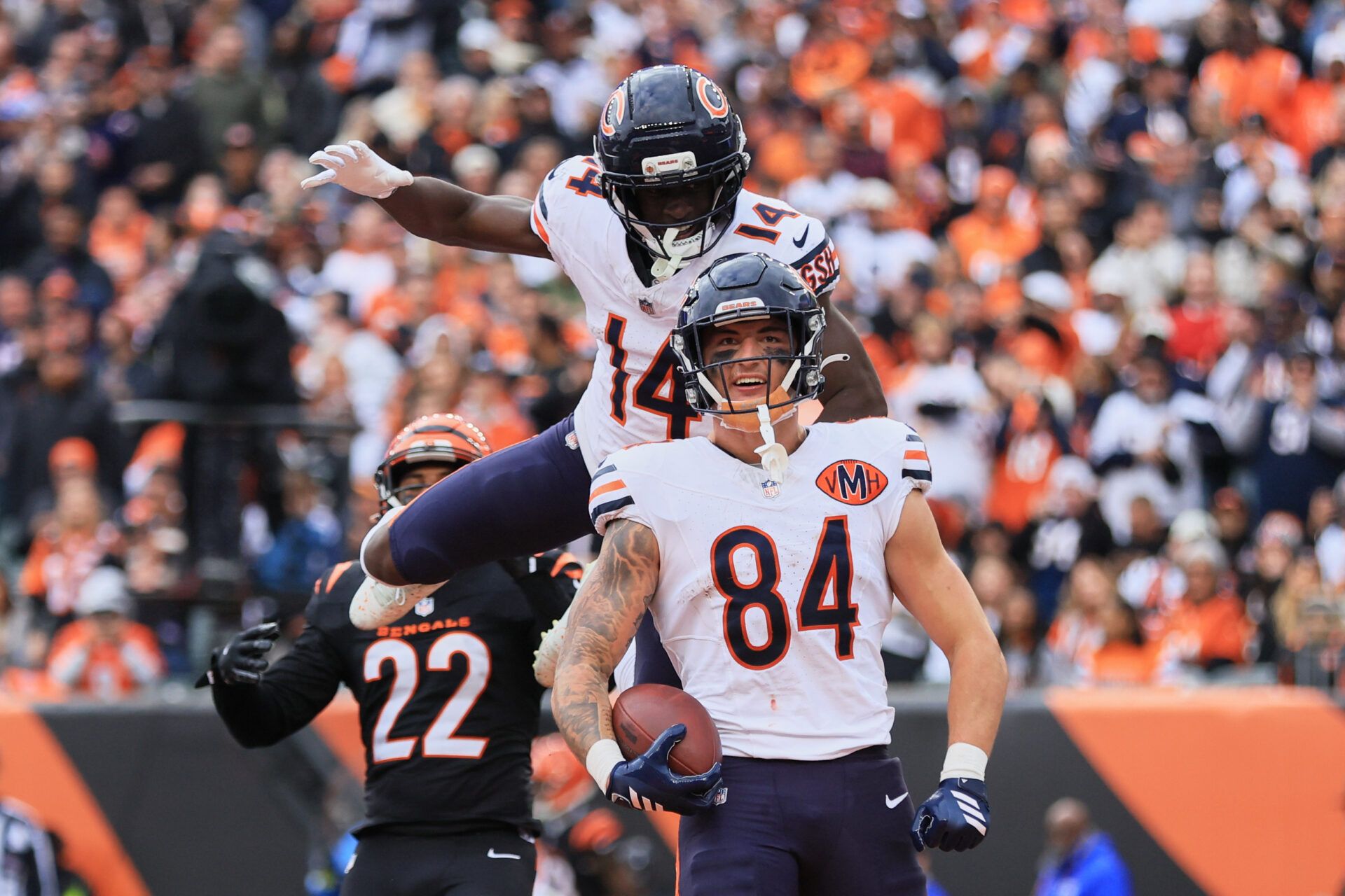 Chicago Bears tight end Colston Loveland (84) celebrates with wide receiver Olamide Zaccheaus (14) after catching a 5-yard touchdown pass thrown by quarterback Caleb Williams (not pictured) against Cincinnati Bengals safety Geno Stone (22) during the third quarter at Paycor Stadium.