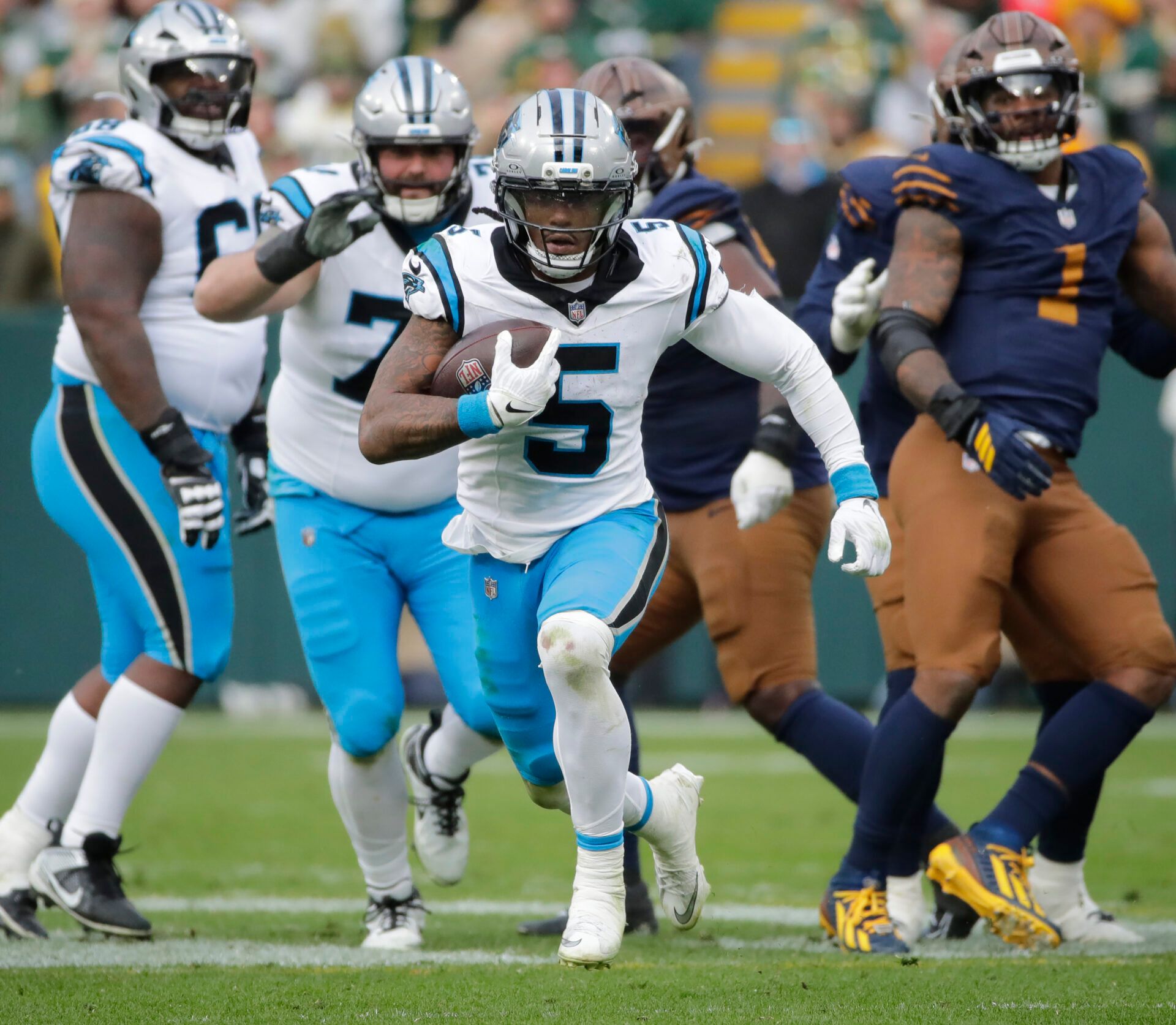 Carolina Panthers running back Rico Dowdle (5) breaks away for a long gain with less than a minute left in the game against the Green Bay Packers during their football game at Lambeau Field.