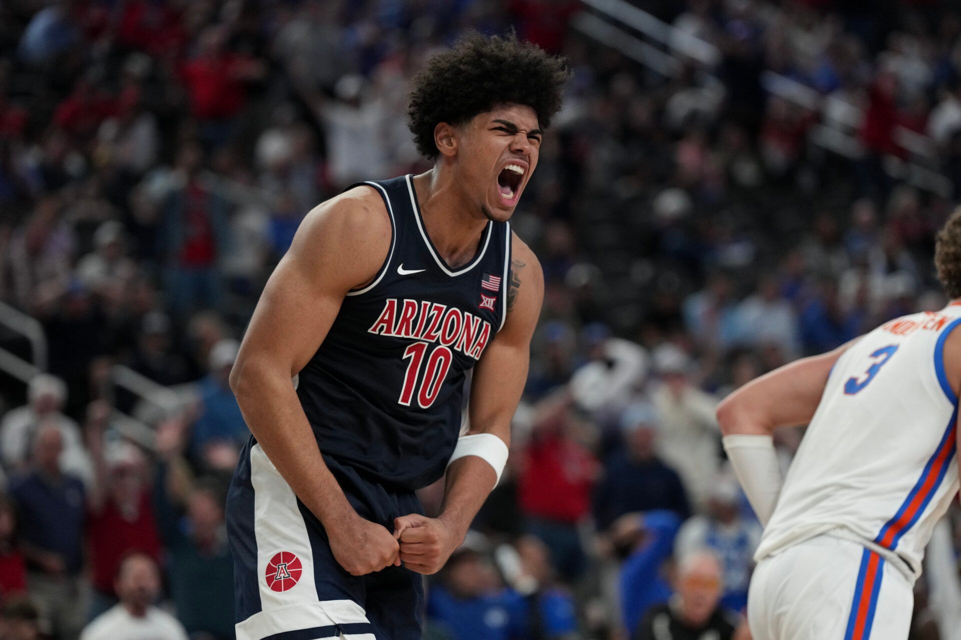 Arizona Wildcats forward Koa Peat (10) celebrates a play against the Florida Gators in the second half of the Hall of Fame Series game at T-Mobile Arena.