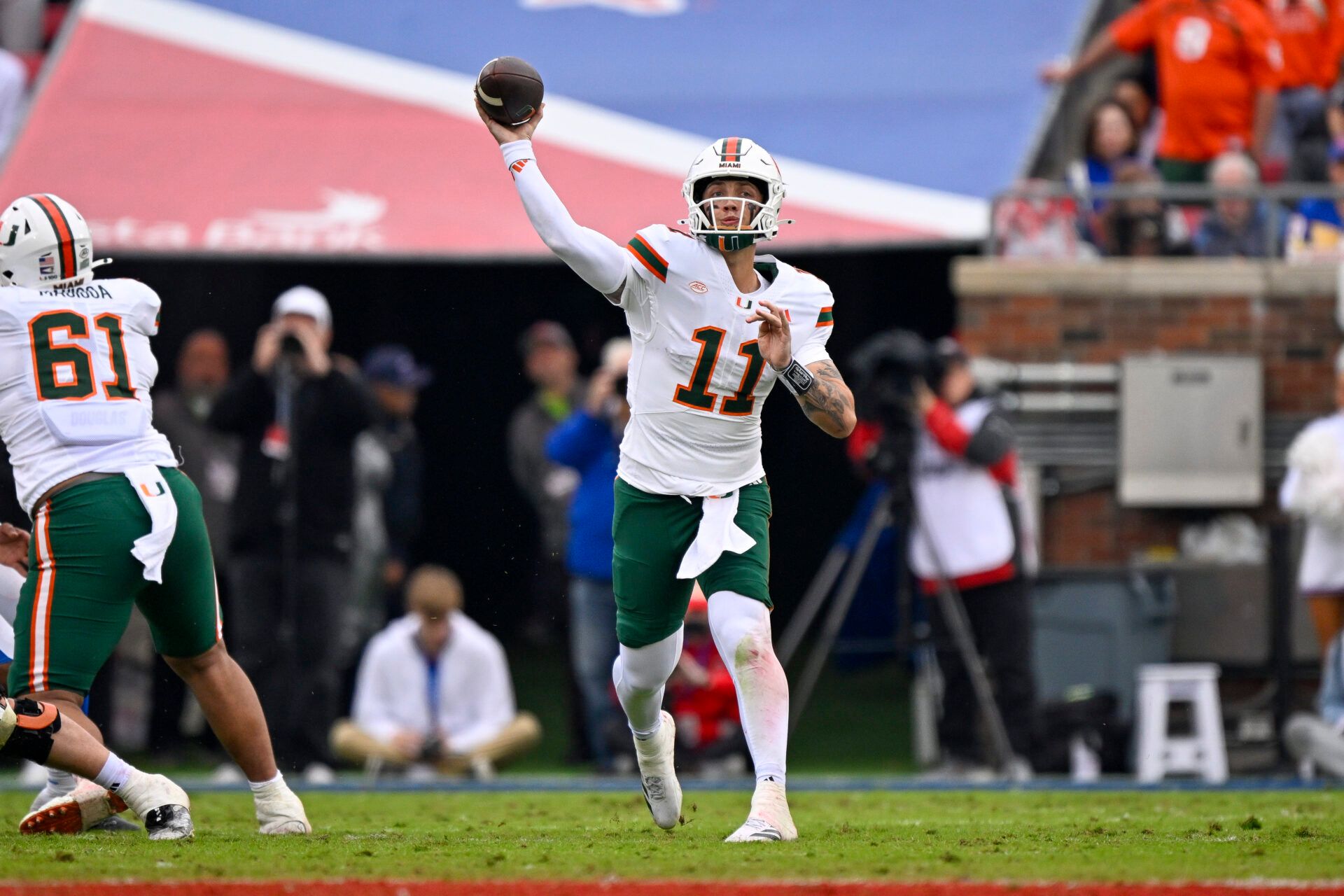 Miami Hurricanes quarterback Carson Beck (11) throws the ball against the SMU Mustangs during the second quarter at Gerald J. Ford Stadium.