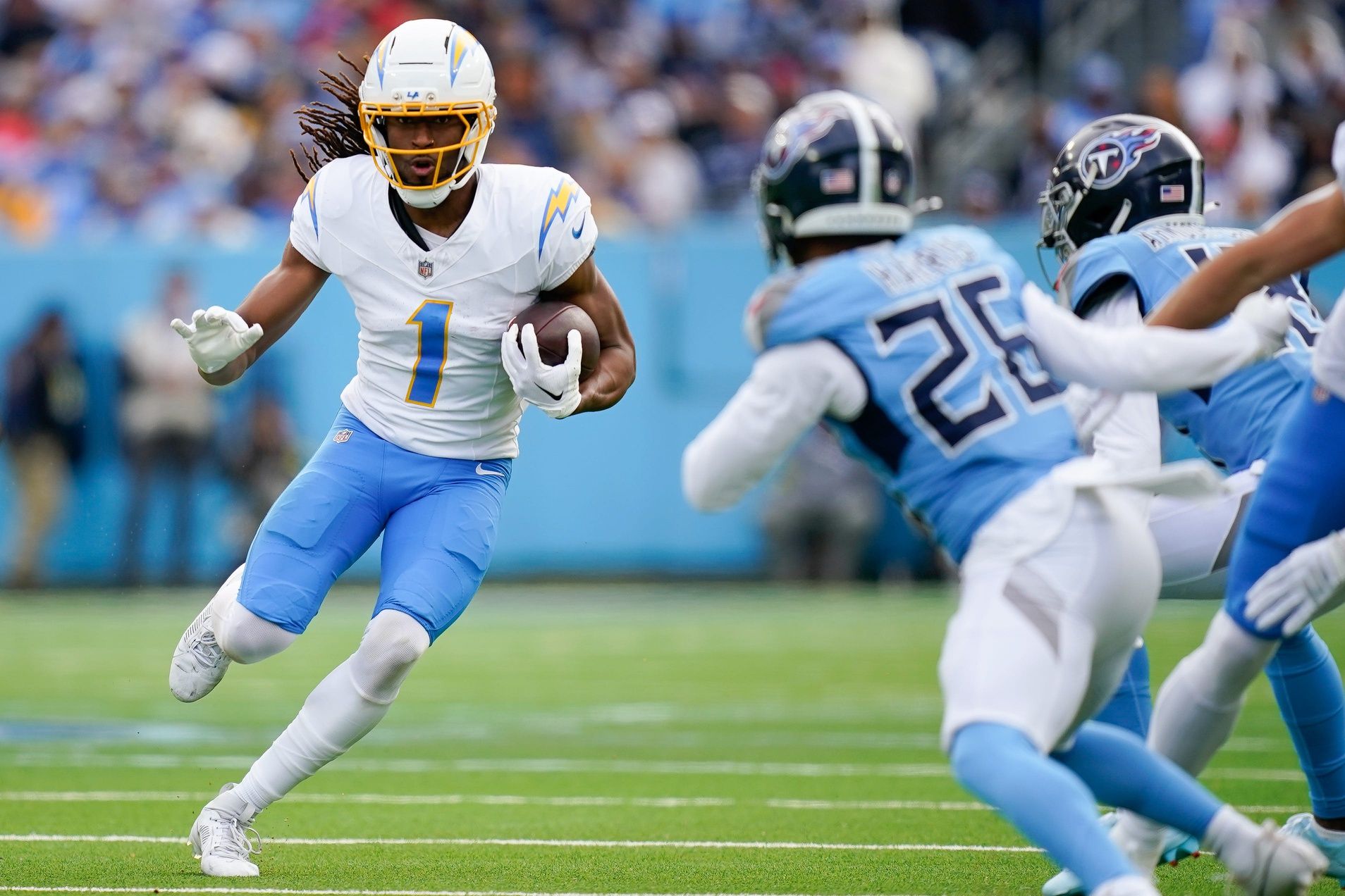 Los Angeles Chargers wide receiver Quentin Johnston (1) runs the ball against the Tennessee Titans during the second quarter at Nissan Stadium in Nashville, Tenn., Sunday, Nov. 2, 2025.
