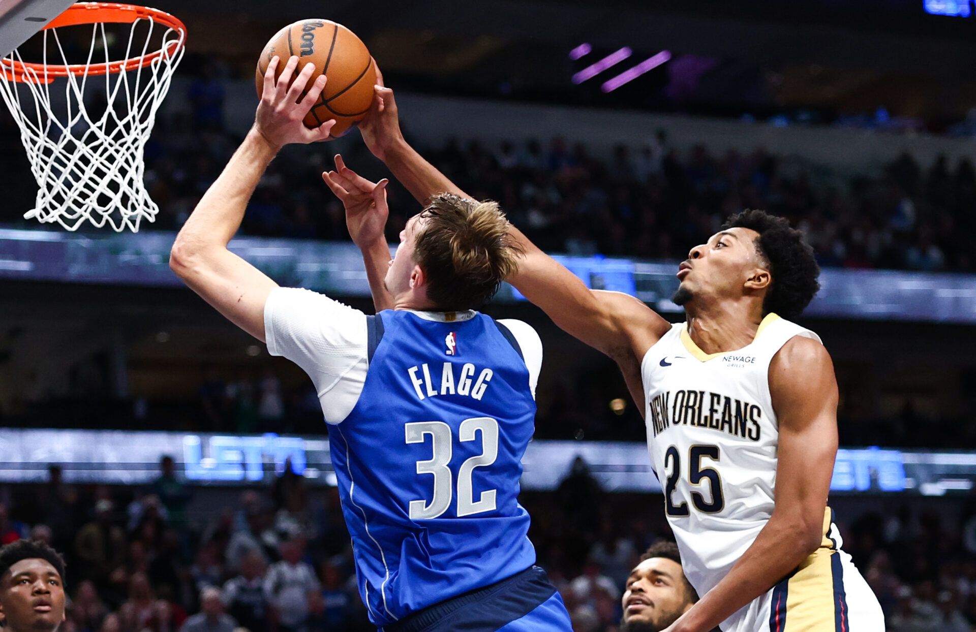 Dallas Mavericks forward Cooper Flagg (32) shoots as New Orleans Pelicans forward Trey Murphy III (25) defends during the second half at American Airlines Center.