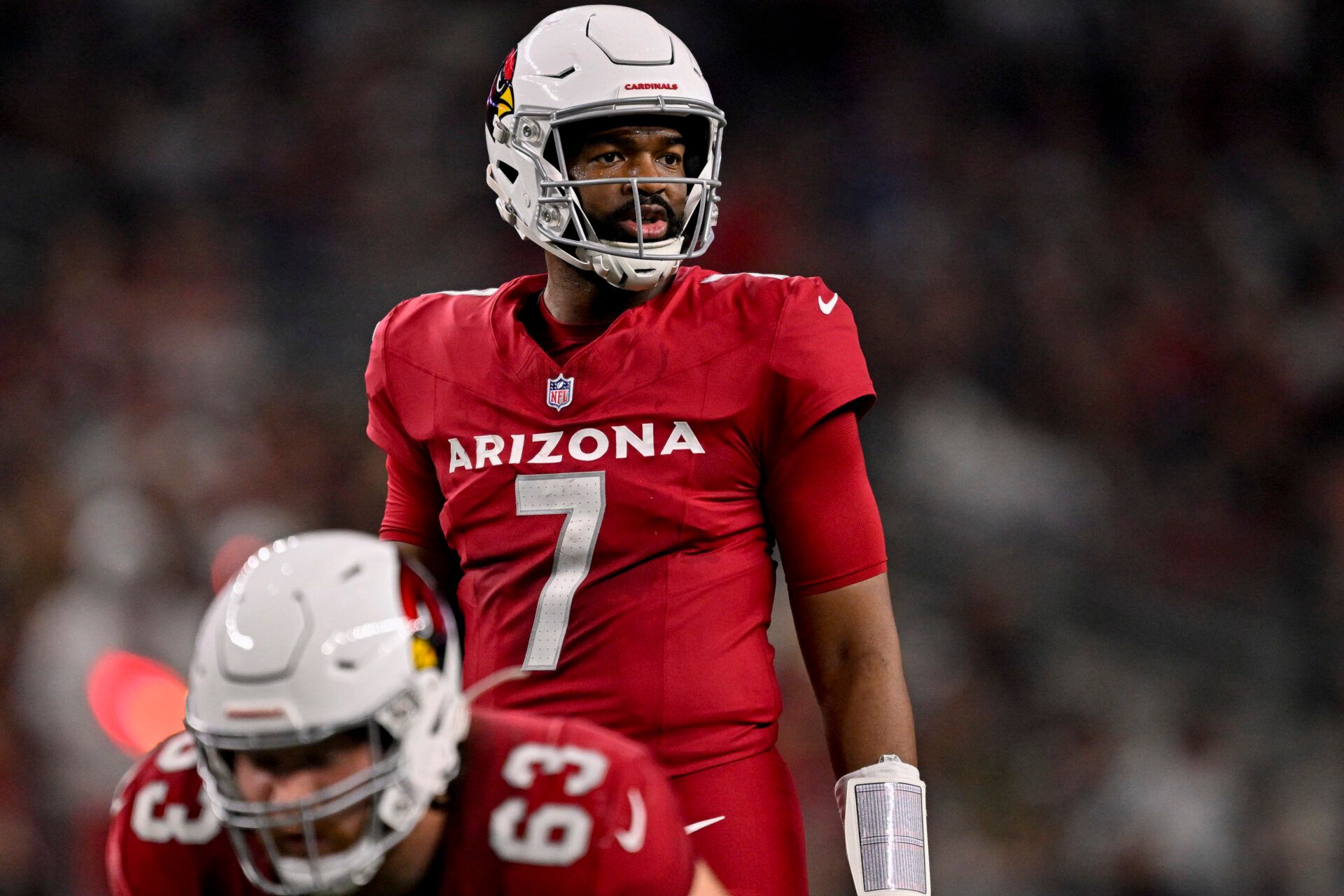 Arizona Cardinals quarterback Jacoby Brissett (7) sets the play at the line during the game between the Dallas Cowboys and the Arizona Cardinals at AT&T Stadium.