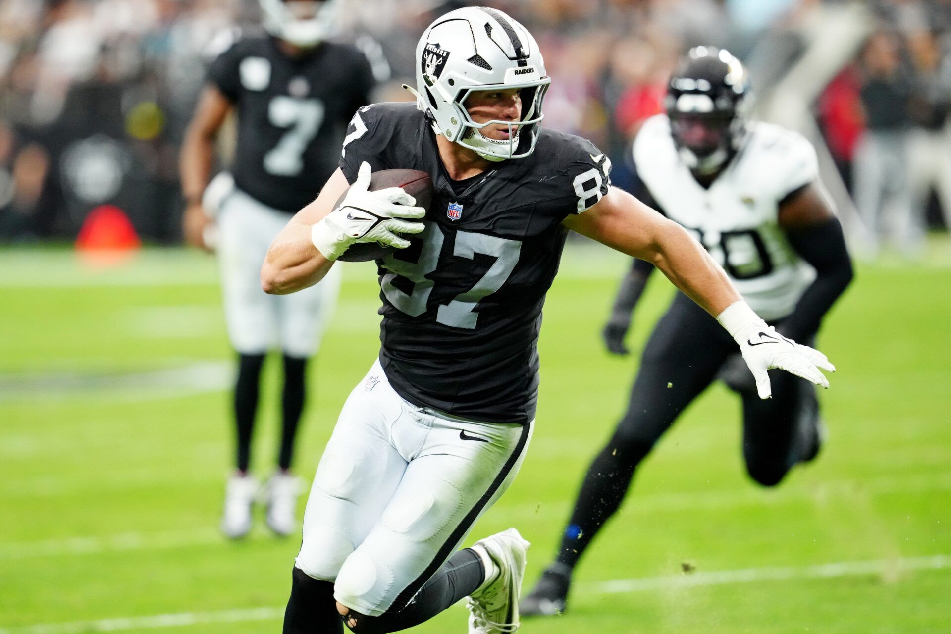 Las Vegas Raiders tight end Michael Mayer (87) runs the ball during the second half against the Jacksonville Jaguars at Allegiant Stadium.