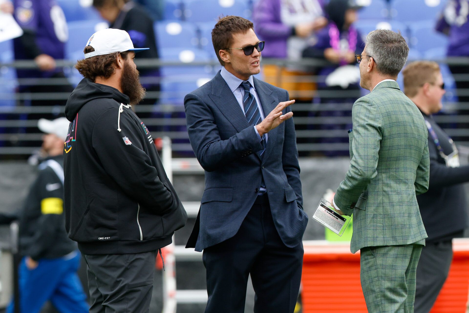 Fox Sports announcer Tom Brady looks on before the game between the Baltimore Ravens and the Los Angeles Rams at M&T Bank Stadium.
