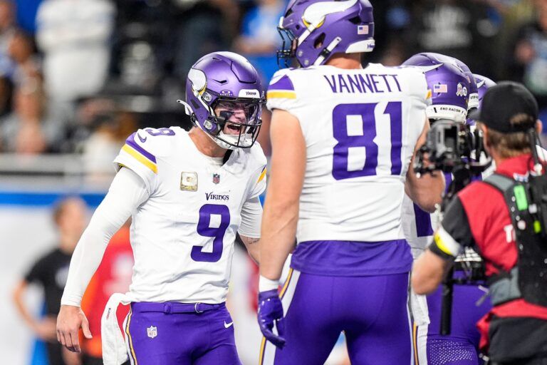 Minnesota Vikings quarterback J.J. McCarthy (9) celebrates a touchdown against Detroit Lions with wide receiver Justin Jefferson (18) during the first half at Ford Field in Detroit on Sunday, November 2, 2025.