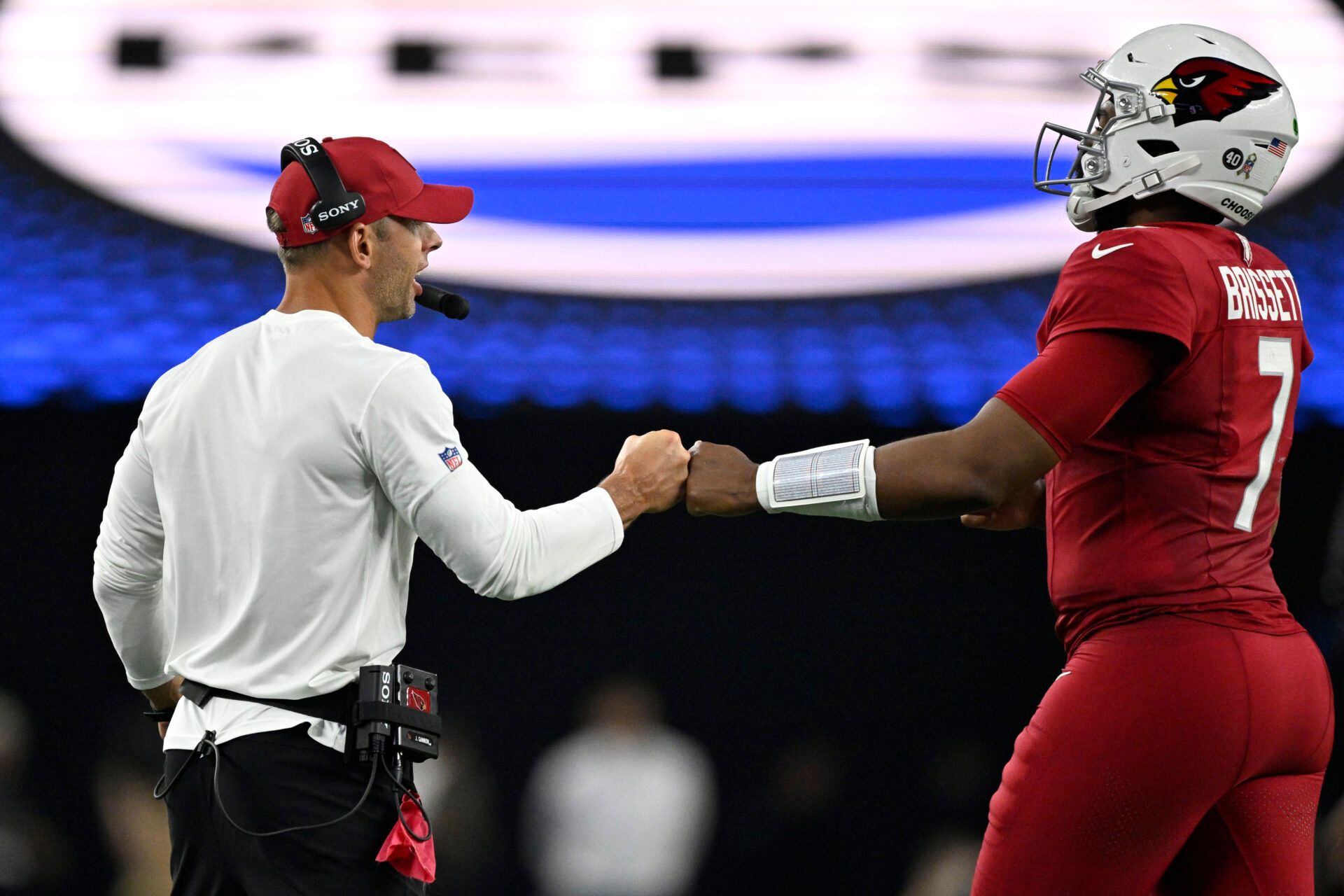 Arizona Cardinals head coach Jonathan Gannon greets quarterback Jacoby Brissett (7) in the second half at AT&T Stadium.