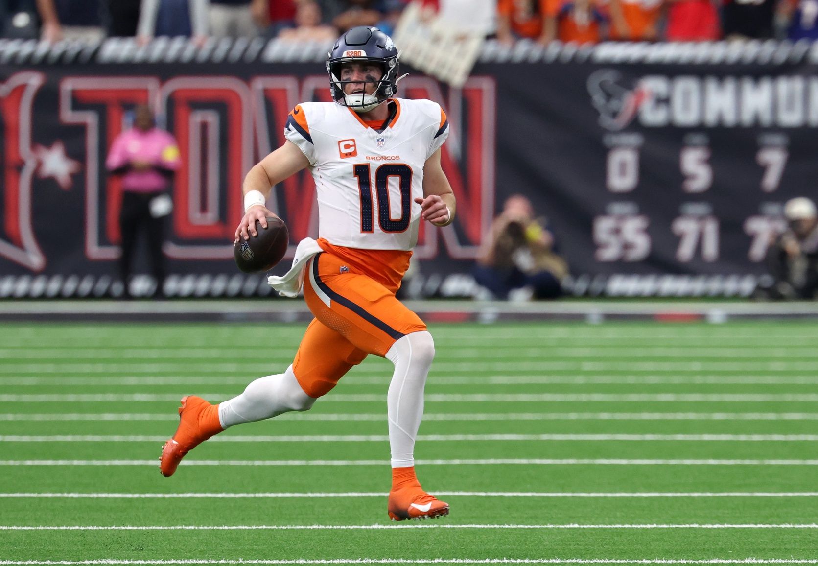 Denver Broncos quarterback Bo Nix (10) scrambles during the second half against the Houston Texans at NRG Stadium.
