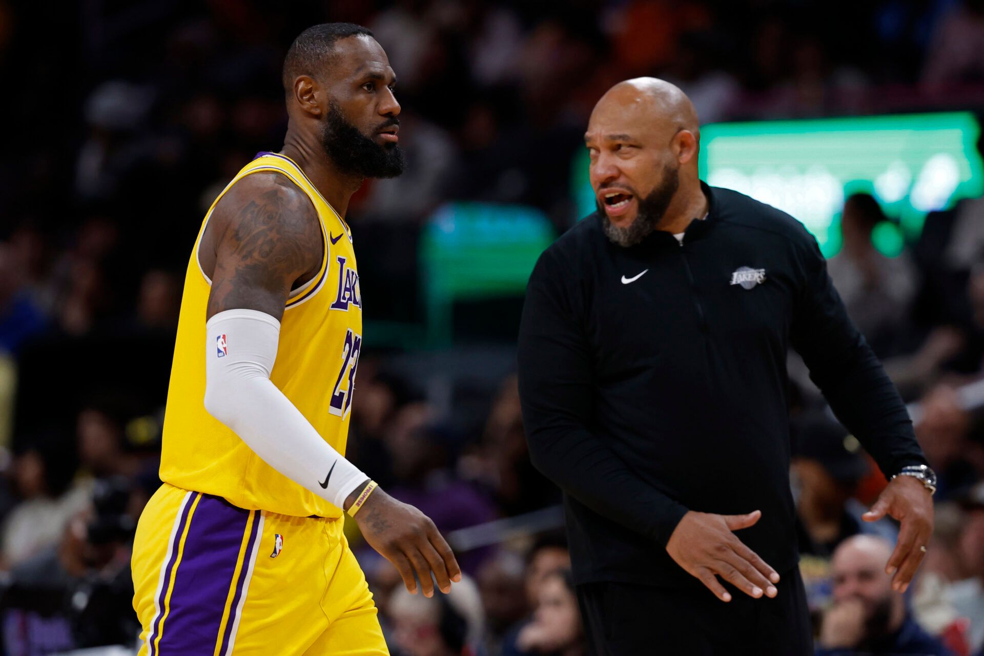 Los Angeles Lakers forward LeBron James (23) talks with Lakers head coach Darvin Ham (R) against the Washington Wizards at Capital One Arena.