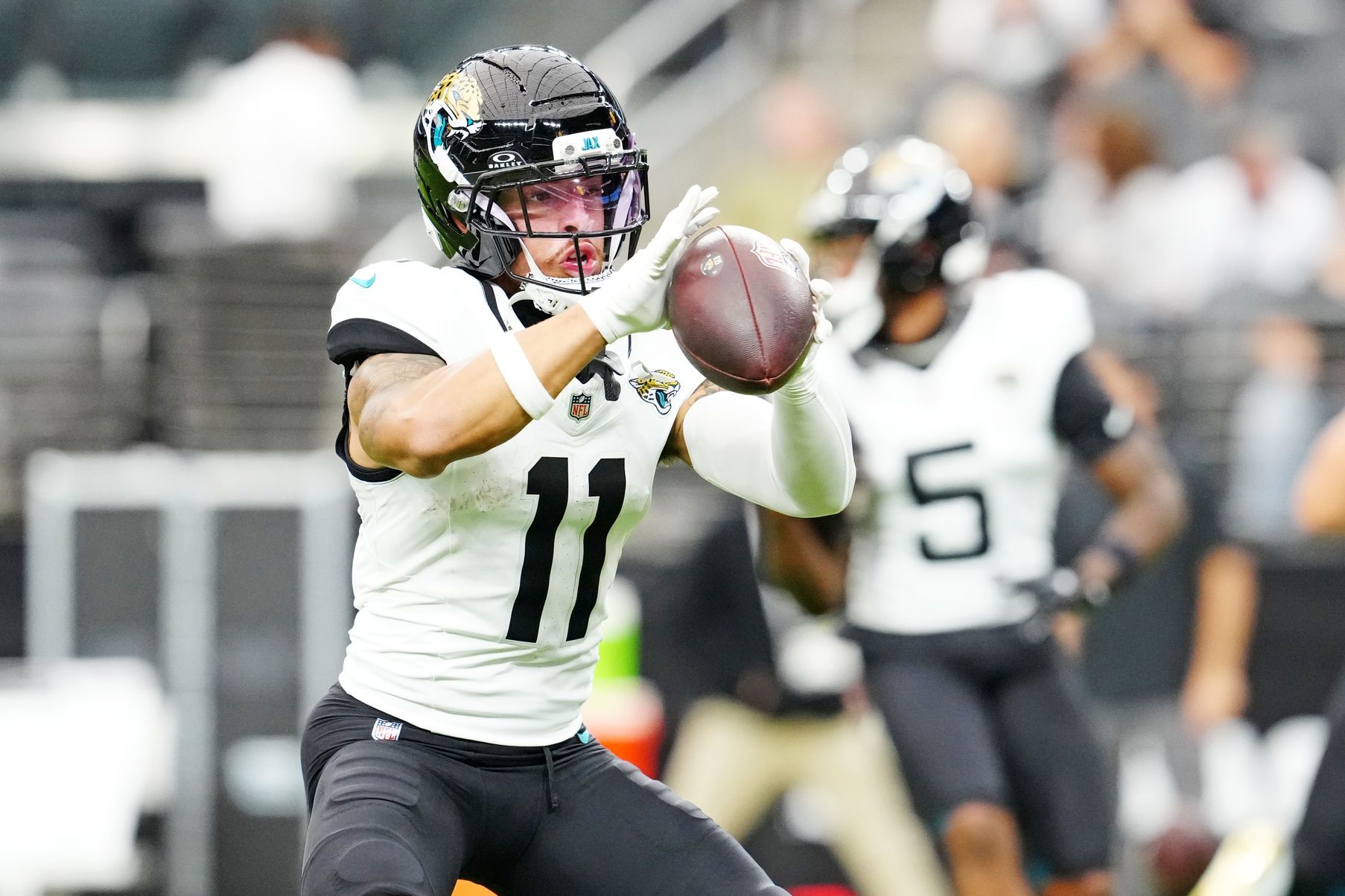 Jacksonville Jaguars wide receiver Parker Washington (11) warms up before the game against the Las Vegas Raiders at Allegiant Stadium.
