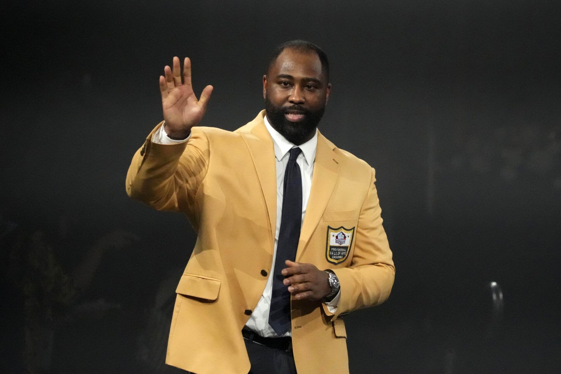New York Jets, Tampa Bay Buccaneers, New England Patriots and Kansas City Chiefs former cornerback Darrelle Revis reacts during the Pro Football Hall of Fame Gold Jacket dinner at Canton Civic Center.