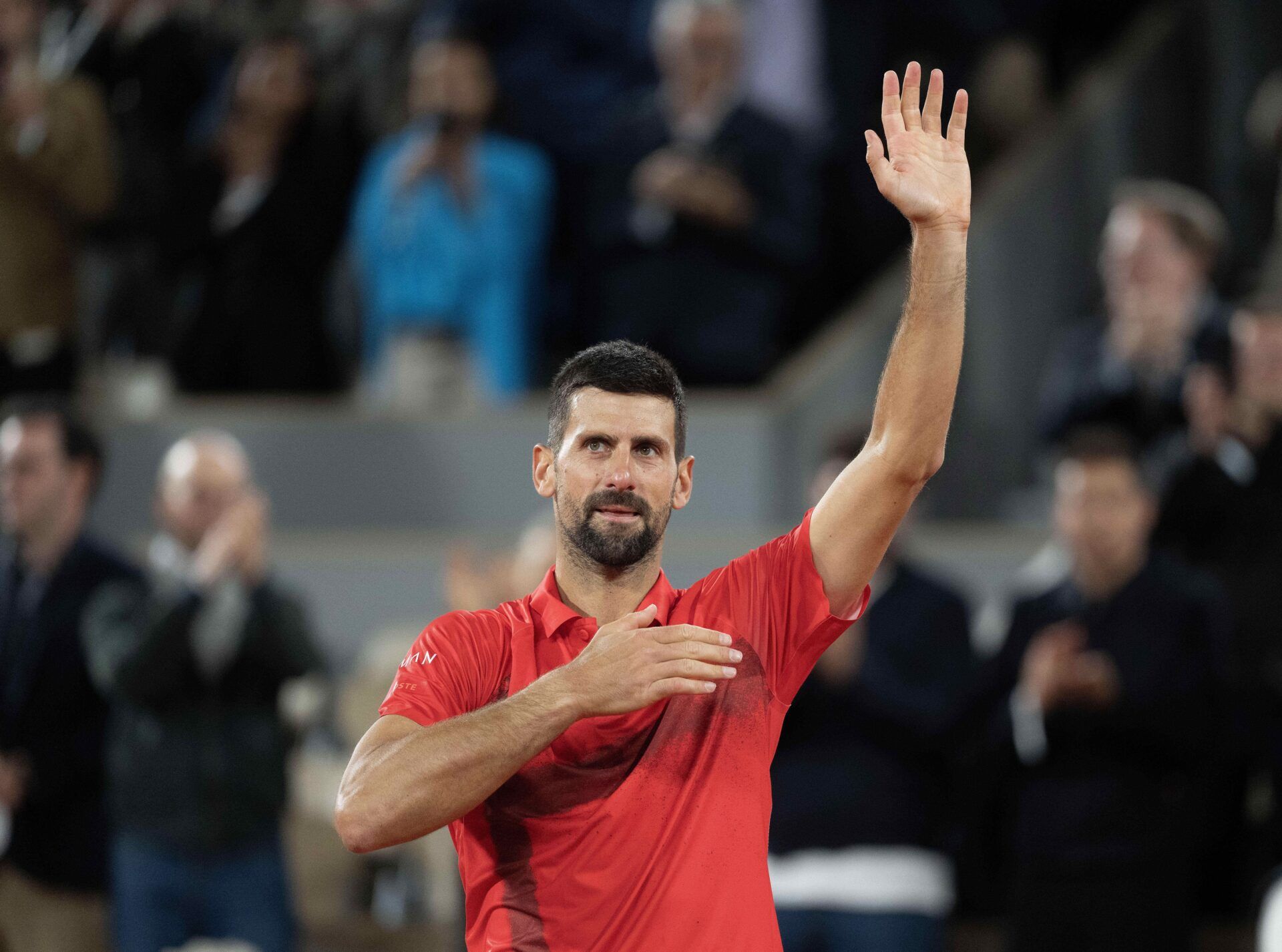 Paris, FR;  Novak Djokovic of Serbia says goodbye to the spectators and the clay after losing his match against Jannik Sinner of Italy on day 13 at Roland Garros Stadium.