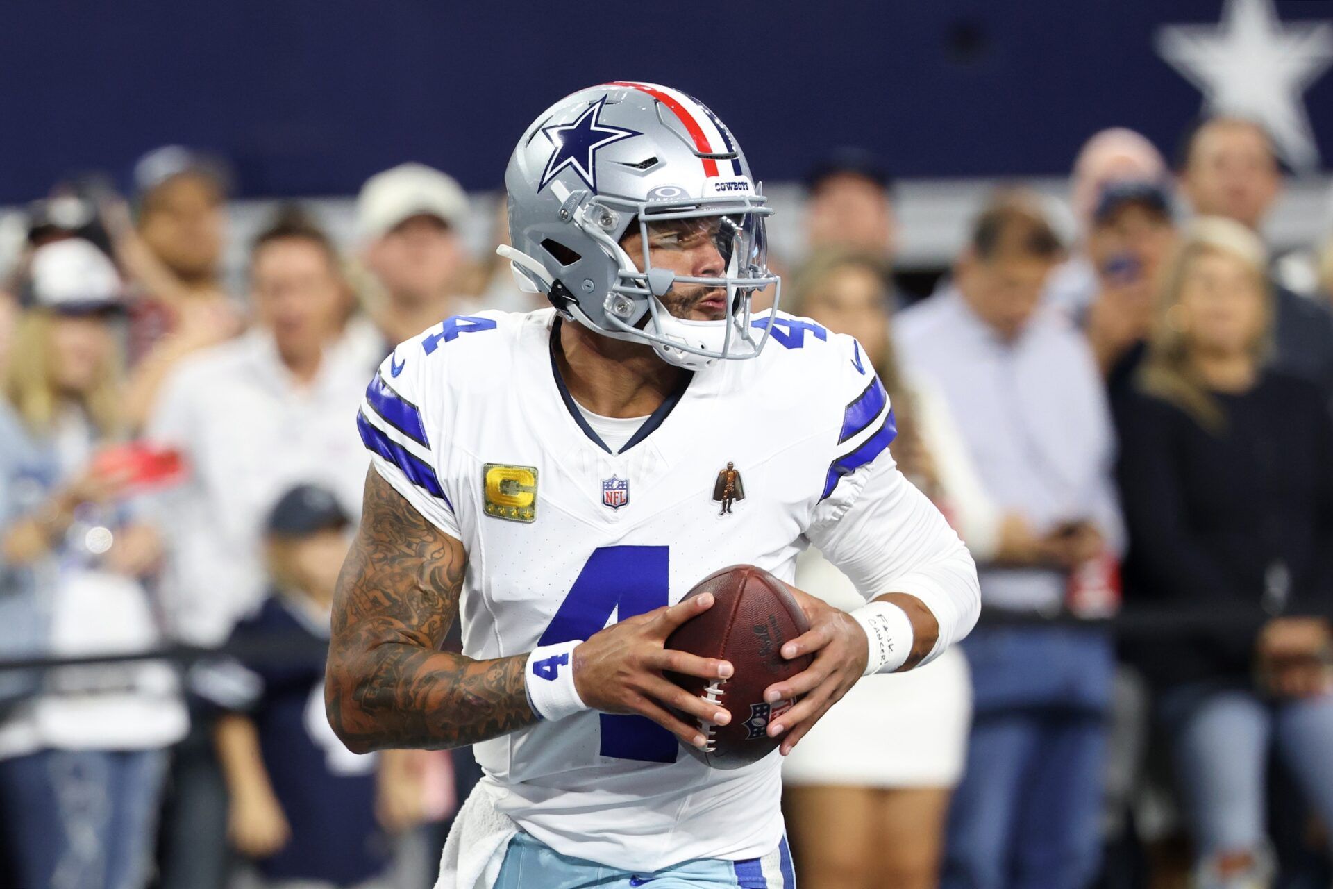 Dallas Cowboys quarterback Dak Prescott (4) warms up before the game against the Arizona Cardinals at AT&T Stadium.