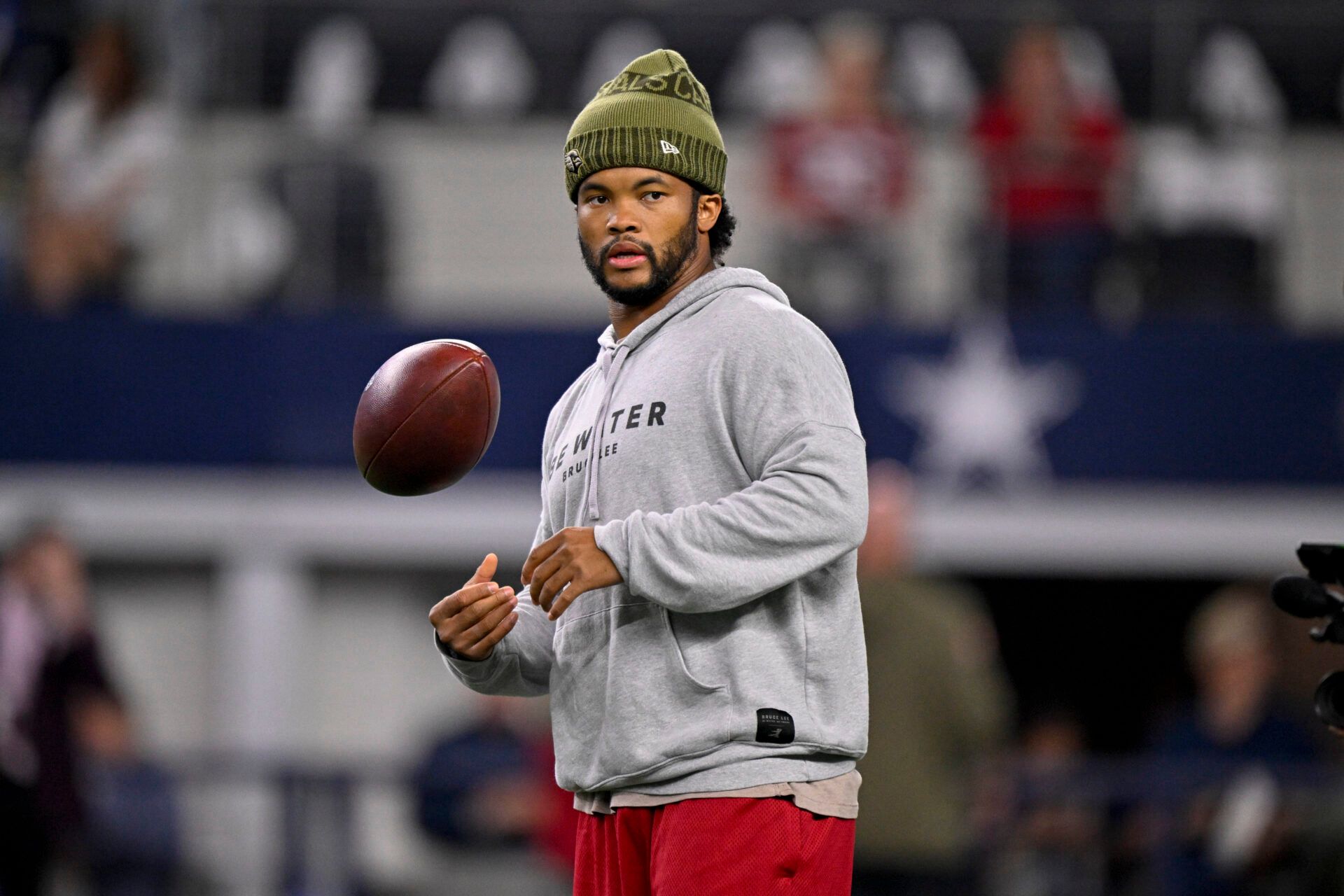 Arizona Cardinals quarterback Kyler Murray (1) looks on from the field before the game between the Dallas Cowboys and the Arizona Cardinals at AT&T Stadium.