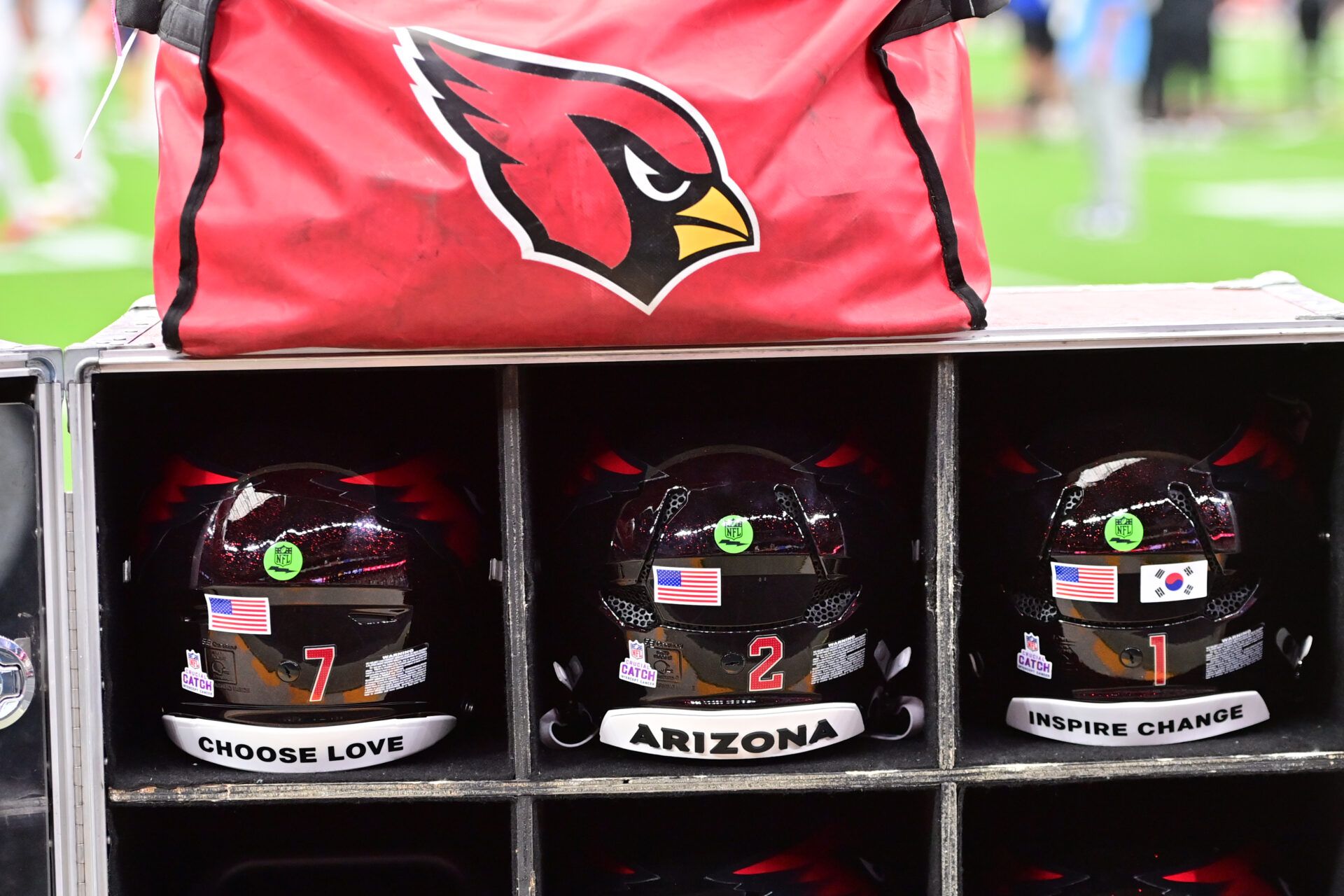 Arizona Cardinals helmets on the sidelines before the game between the Tennessee Titans and the Arizona Cardinals at State Farm Stadium.