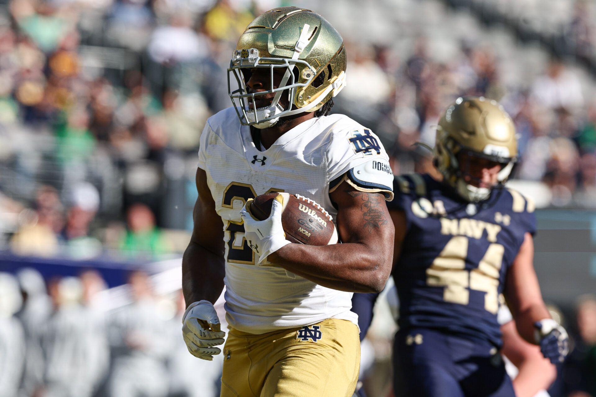 Notre Dame Fighting Irish running back Kedren Young (21) celebrates a rushing touchdown during the second half against the Navy Midshipmen at MetLife Stadium.