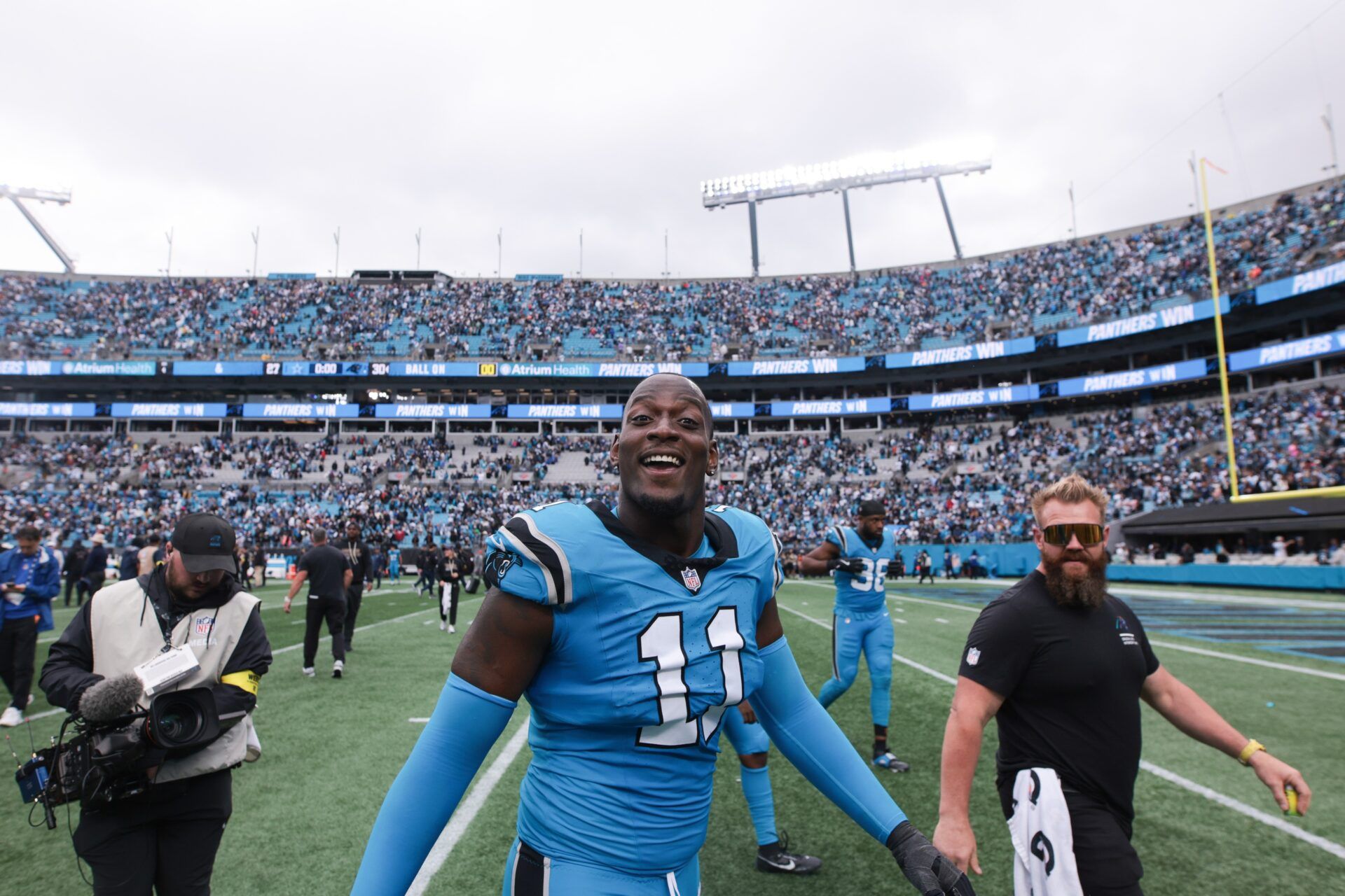 Carolina Panthers linebacker Nic Scourton (11) looks on after the game against the Dallas Cowboys at Bank of America Stadium.