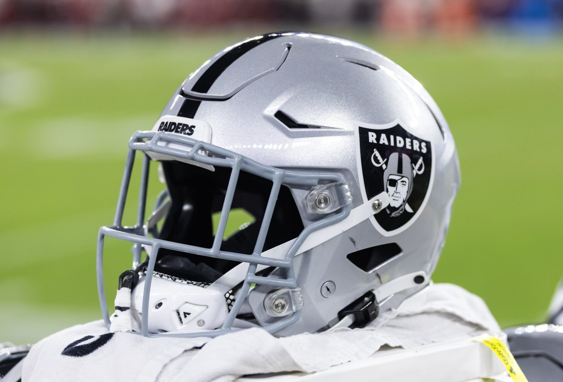 Detailed view of a Las Vegas Raiders helmet during a preseason NFL game at State Farm Stadium.