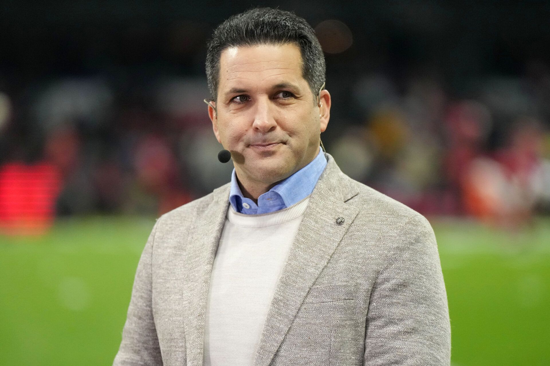 Broadcaster Adam Schefter of ESPN’s Monday Night Football Countdown is seen on the sideline prior to the NFL International Series game between the Arizona Cardinals and the San Francisco 49ers at Estadio Azteca.