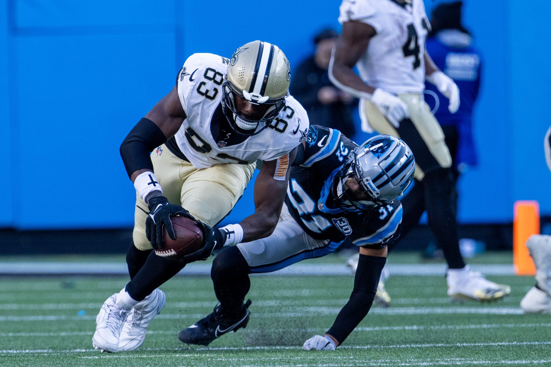 New Orleans Saints tight end Juwan Johnson (83) gets by Carolina Panthers cornerback Caleb Farley (31) during the fourth quarter at Bank of America Stadium.