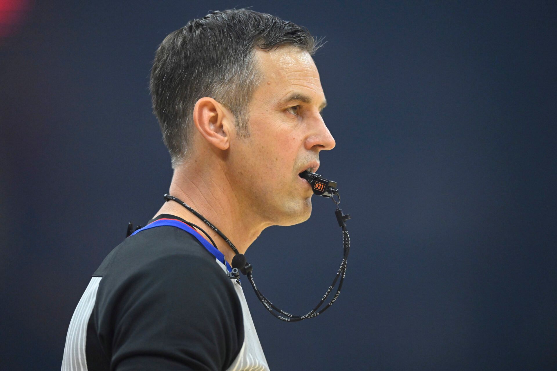 NBA referee Kevin Scott (24) stands on the court in the first quarter of a game between the Cleveland Cavaliers and the Philadelphia 76ers at Rocket Arena.