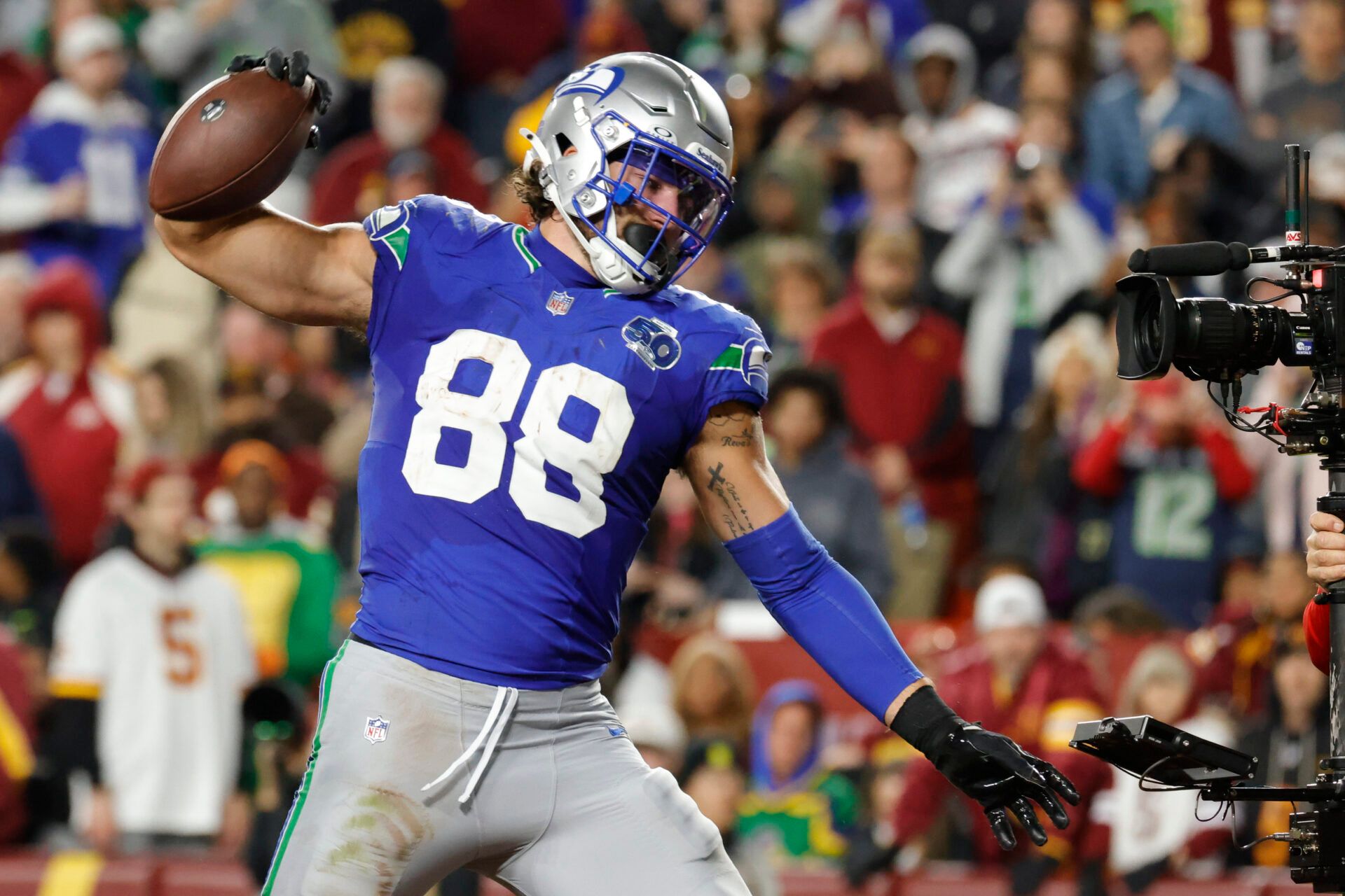 Seattle Seahawks tight end AJ Barner (88) celebrates scoring a touchdown against the Washington Commanders during the second half at Northwest Stadium.
