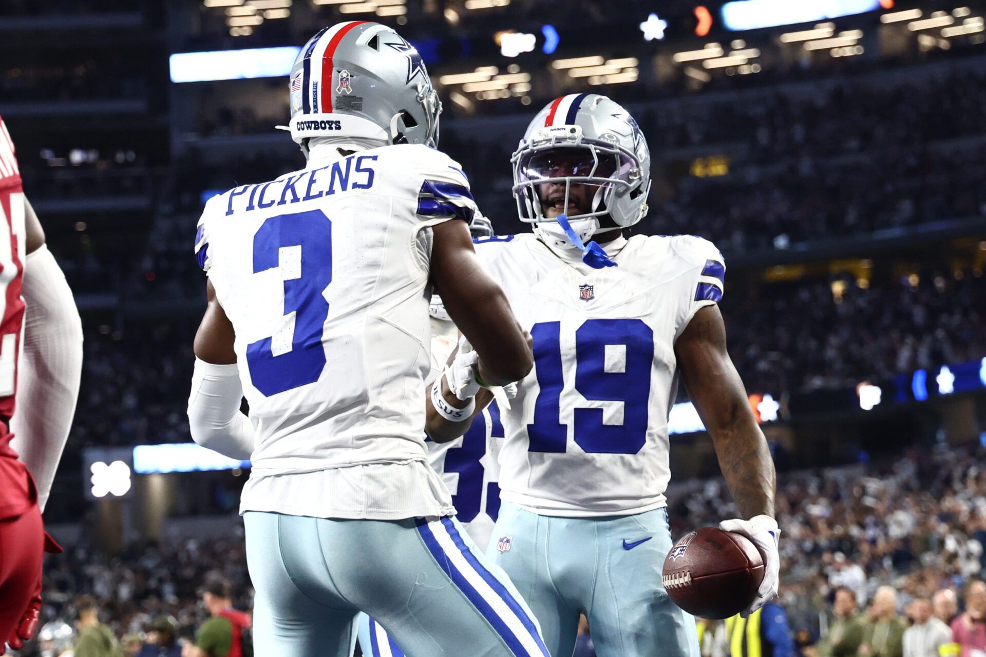 Dallas Cowboys wide receiver Ryan Flournoy (19) celebrates with wide receiver George Pickens (3) after scoring a touchdown against the Arizona Cardinals in the second half at AT&T Stadium.