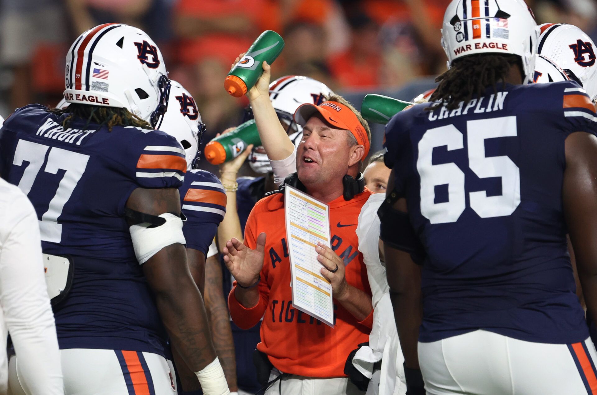 Auburn Tigers head coach Hugh Freeze talks with offensive lineman Jeremiah Wright (77) during the first quarter against the Missouri Tigers at Jordan-Hare Stadium.