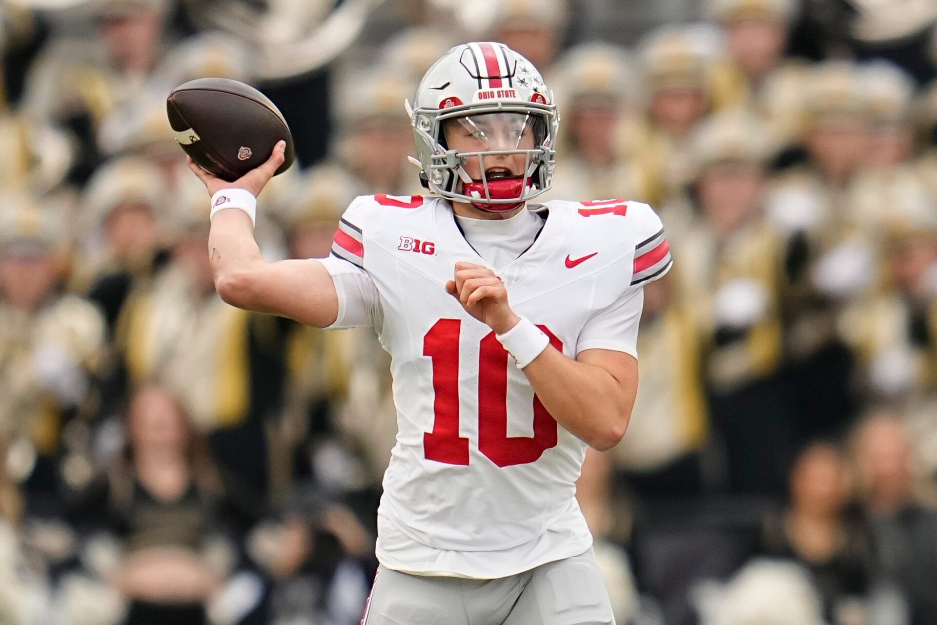 Ohio State Buckeyes quarterback Julian Sayin (10) throws during the NCAA football game against the Purdue Boilermakers at Ross-Ade Stadium in West Lafayette, Ind. on Nov. 8, 2025.
