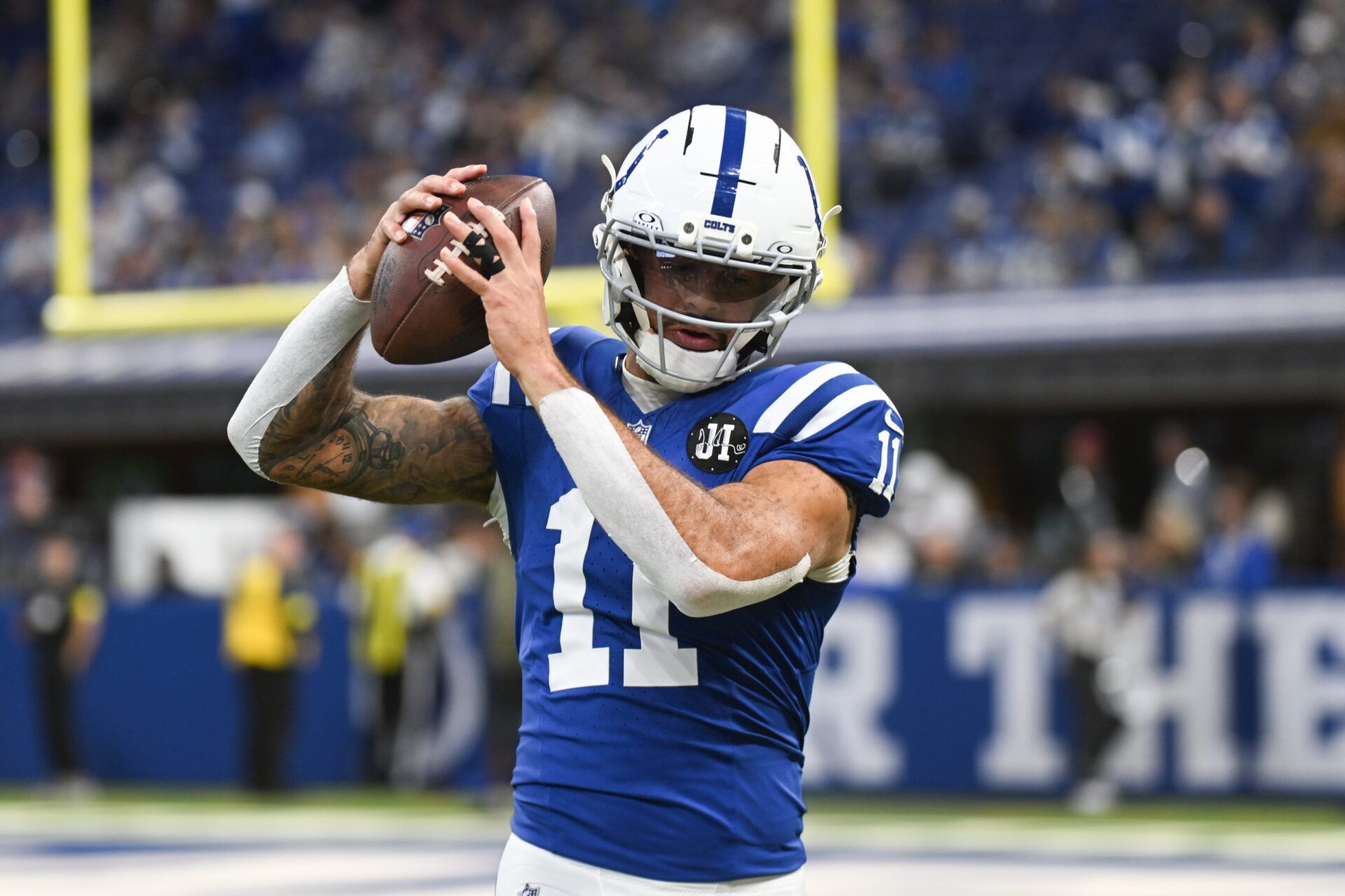 Indianapolis Colts wide receiver Michael Pittman Jr. (11) warms up before the game against the Tennessee Titans at Lucas Oil Stadium.