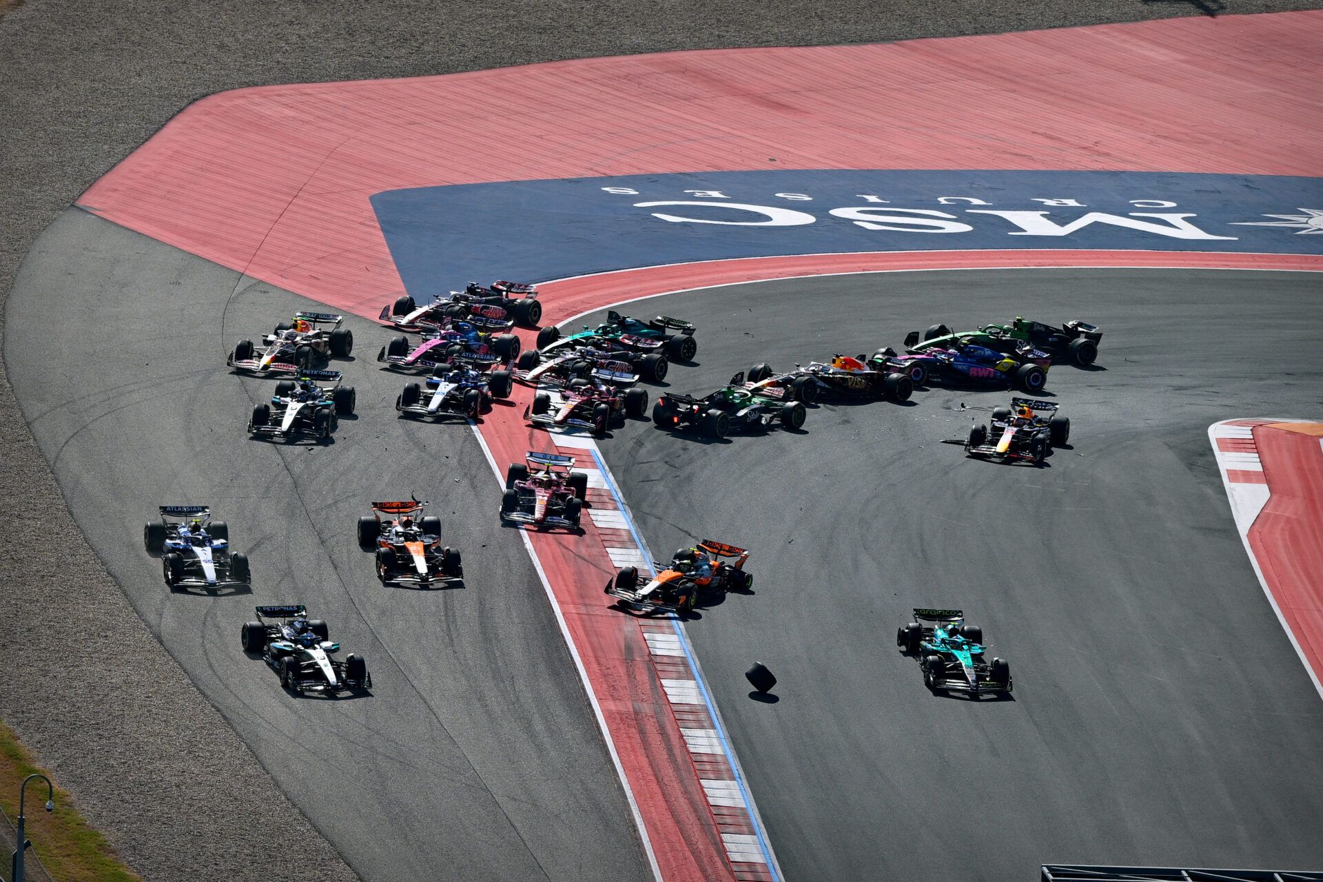 A view of the crash involving McLaren Formula 1 driver Lando Norris (4) of Team Great Britain and McLaren Formula 1 driver Oscar Piastri (81) of Team Australia in turn one during the 2025 US Grand Prix Sprint race at Circuit of The Americas Austin.
