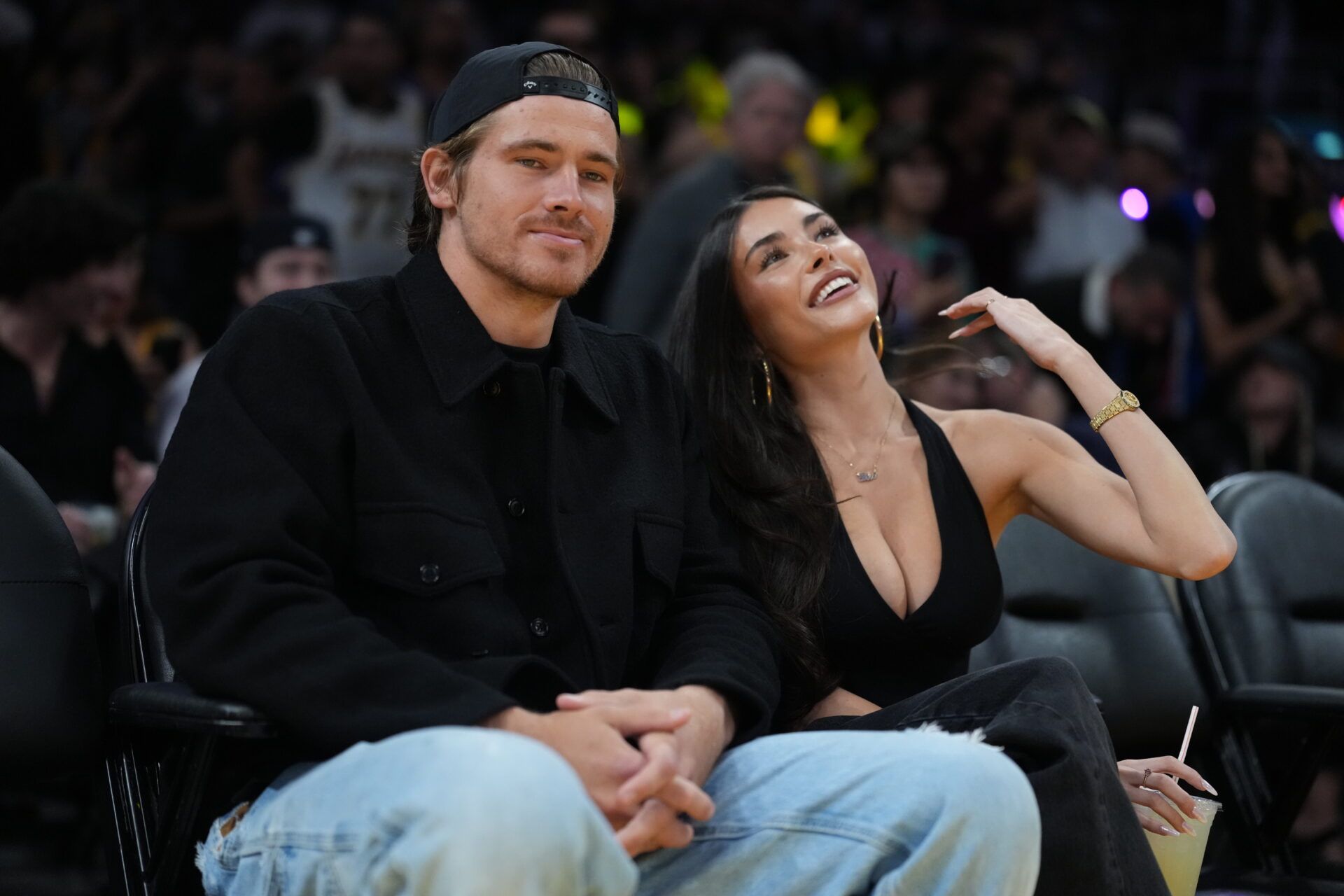 Los Angeles Chargers quarterback Justin Herbert (left) and girlfriend Madison Beer attend the game between the Minnesota Timberwolves and the Los Angeles Lakers at Crypto.com Arena.
