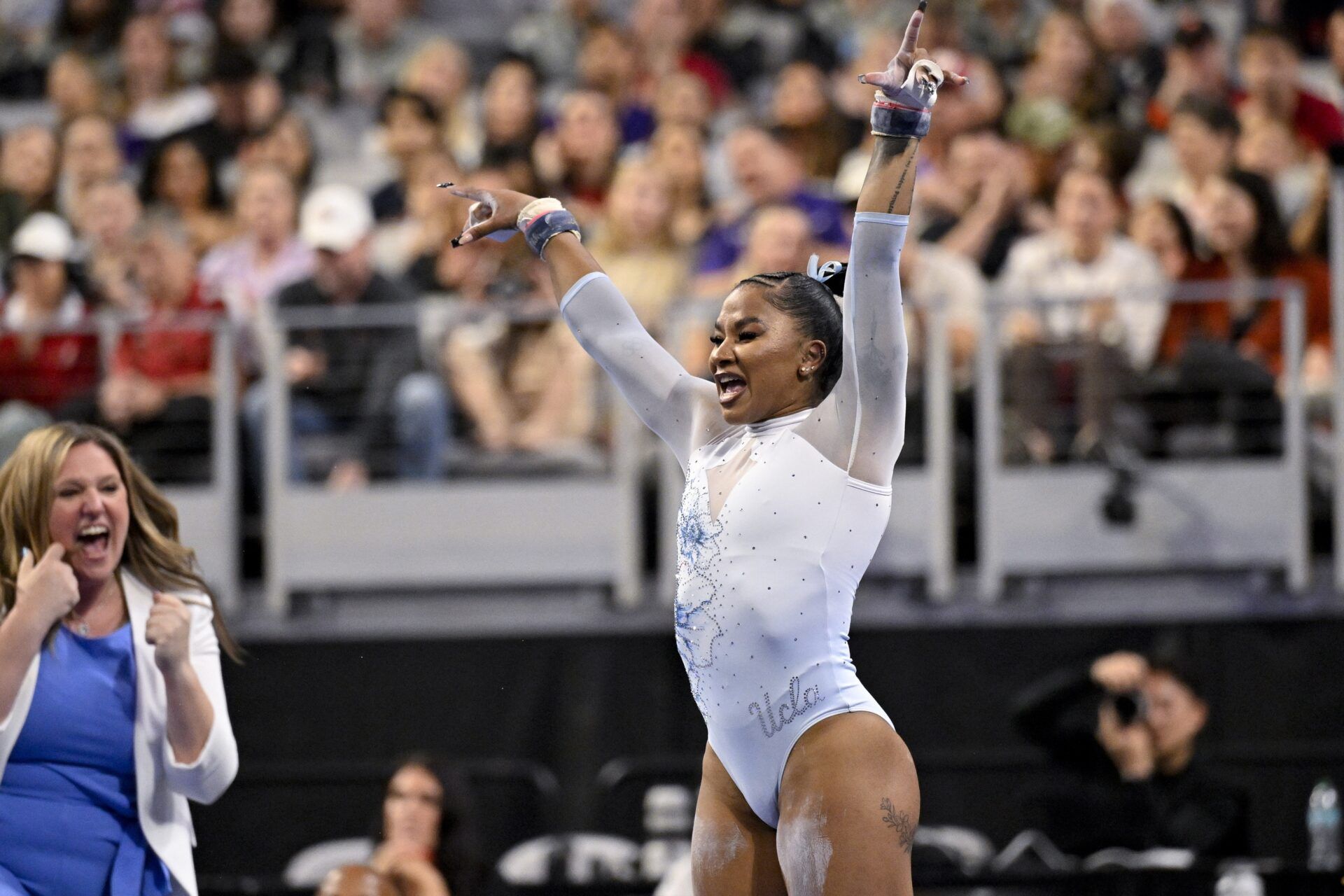 UCLA Bruins gymnast Jordan Chiles performs on uneven bars during the 2025 Women's National Gymnastics Championship at Dickies Arena.