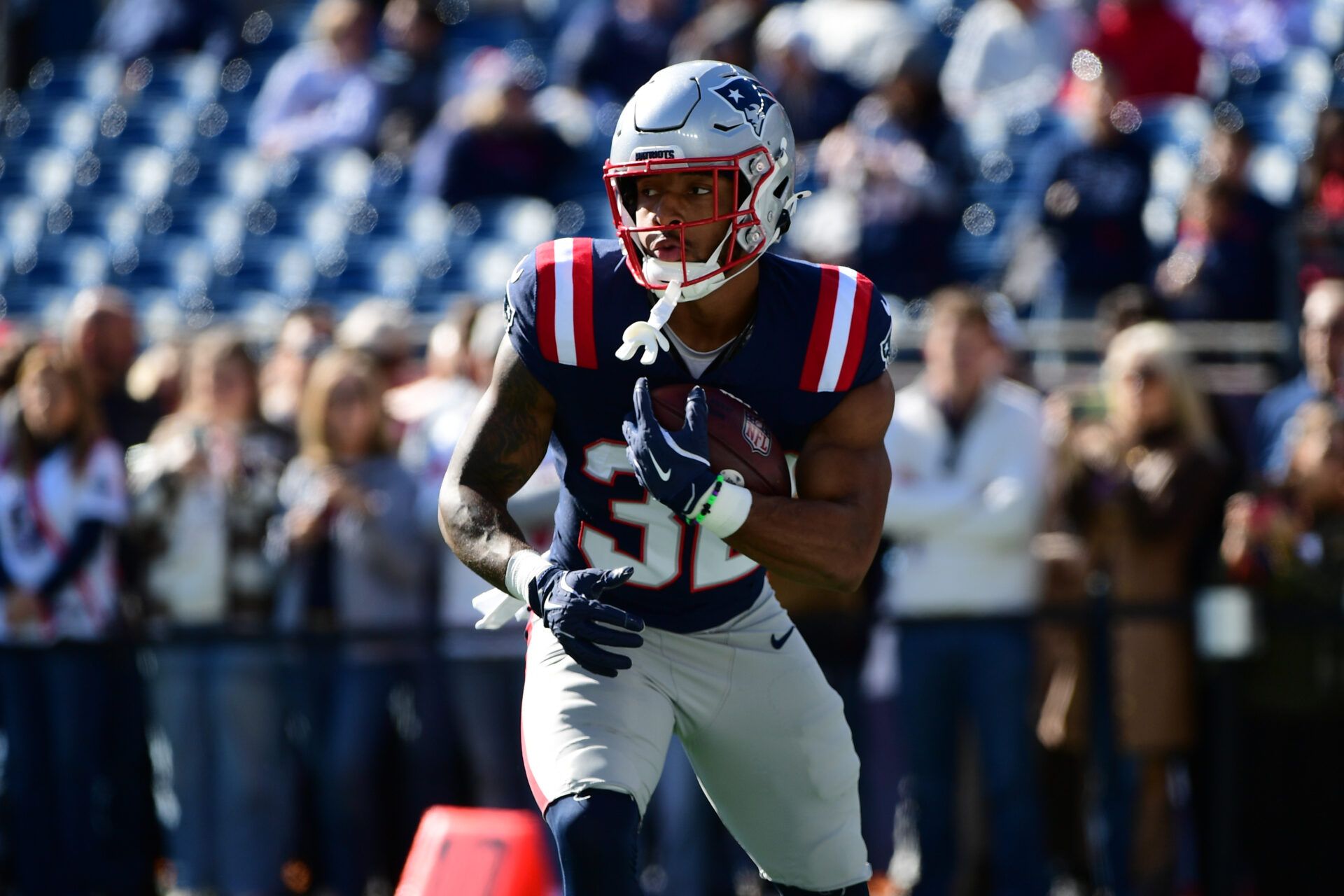 New England Patriots running back Treveyon Henderson (32) warms up prior to the first half against the Cleveland Browns at Gillette Stadium.