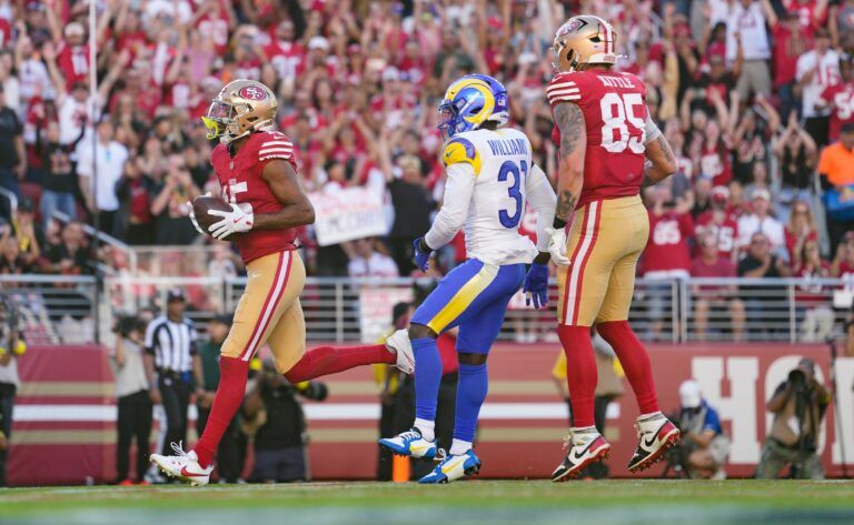 San Francisco 49ers wide receiver Jauan Jennings (15) scores a touchdown past Los Angeles Rams cornerback Darious Williams (31) during the second quarter at Levi's Stadium.