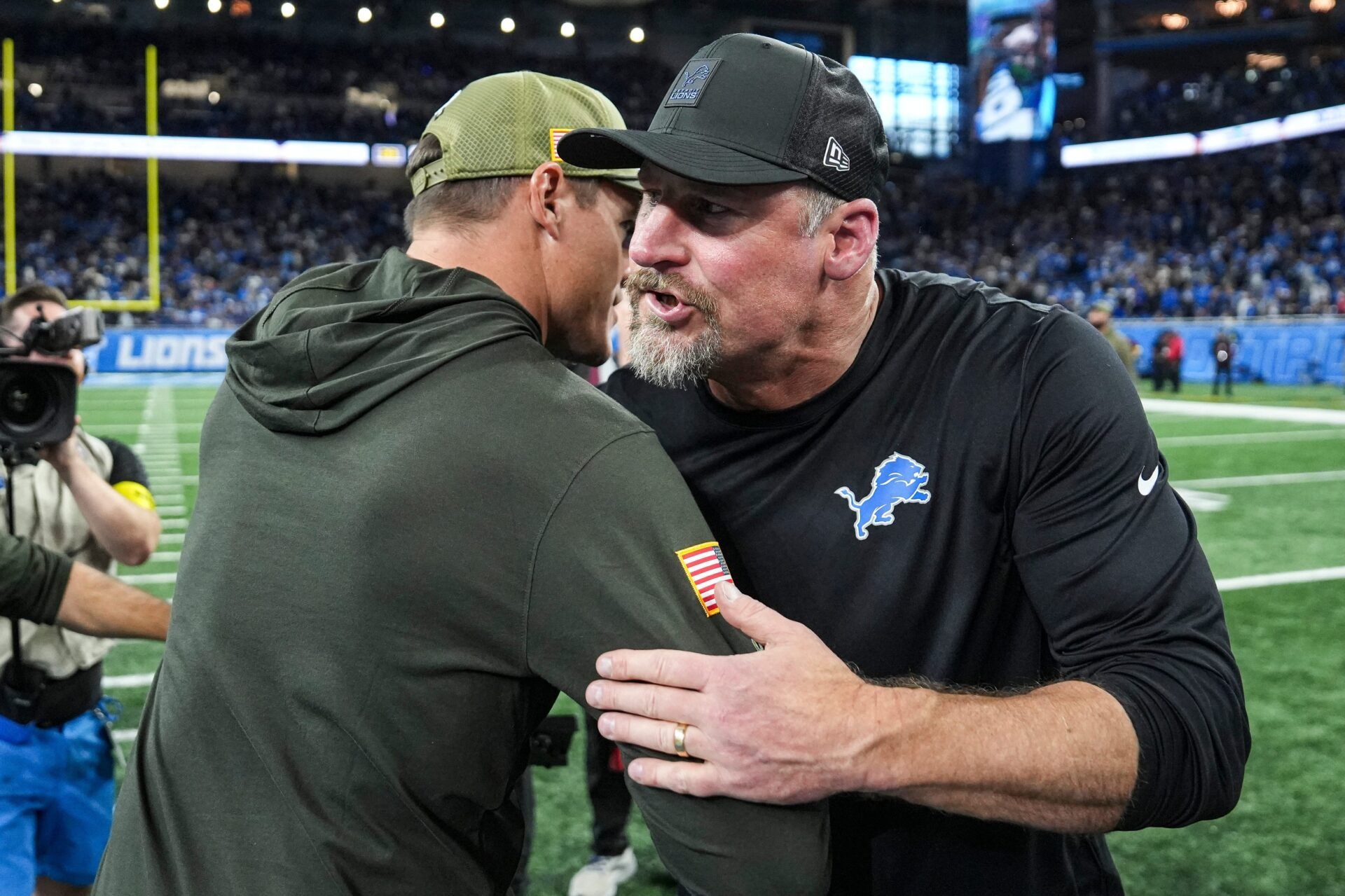 Detroit Lions head coach Dan Campbell hugs Minnesota Vikings head coach Kevin O'Connell after 27-24 loss at Ford Field in Detroit on Sunday, November 2, 2025.