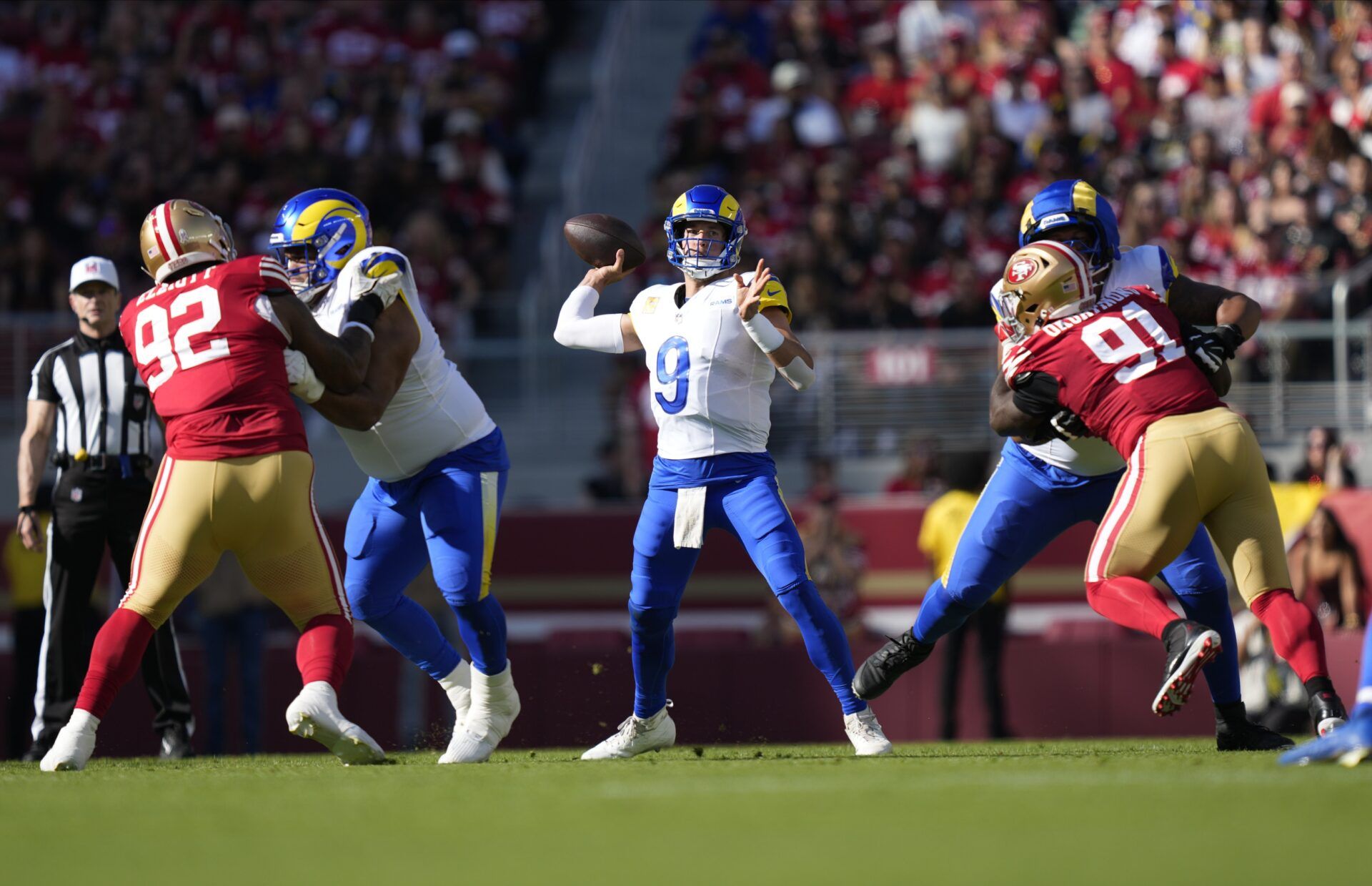Los Angeles Rams quarterback Matthew Stafford (9) throws a pass during the first quarter against the San Francisco 49ers at Levi's Stadium.