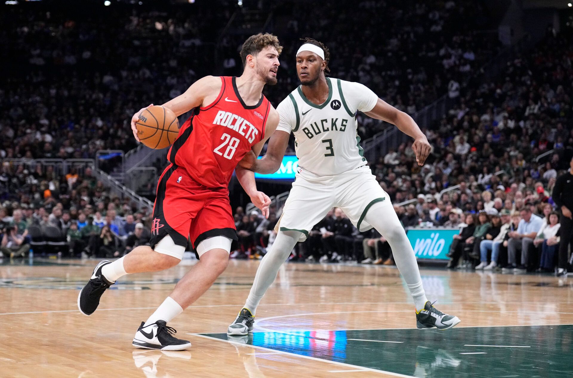 Houston Rockets center Alperen Sengun (28) drives against Milwaukee Bucks center Myles Turner (3) in the first half at Fiserv Forum.