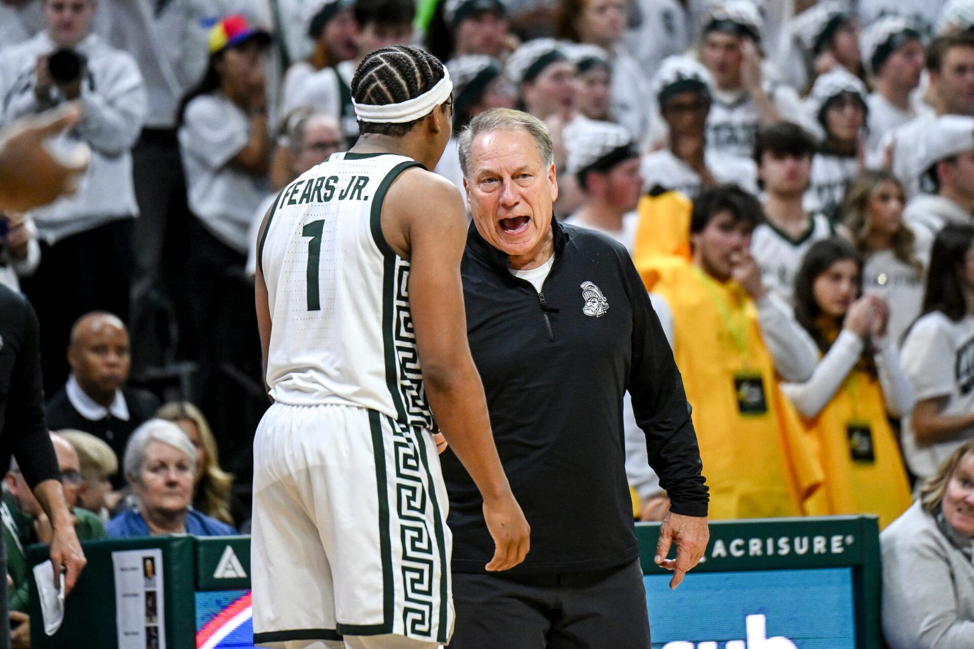 Michigan State's coach Tom Izzo, right, talks with Jeremy Fears Jr. during the second half in the game against Arkansas on Saturday, Nov. 8, 2025, at the Breslin Center in East Lansing.